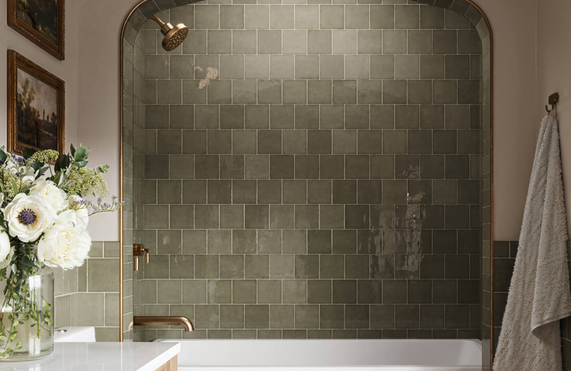 null Small modern bathroom with olive green square wall tiles, brass shower fixtures, and a simple bathtub design