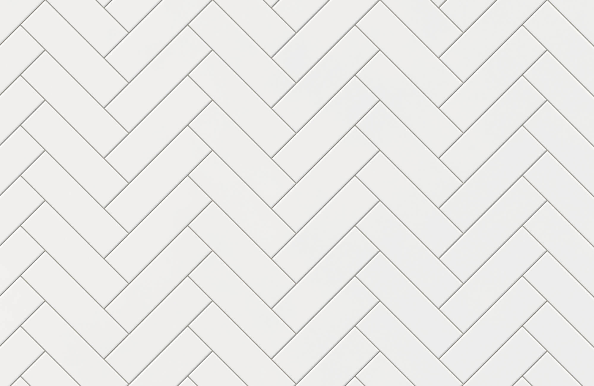 White subway tiles arranged in herringbone pattern with light grout lines, highlighting geometric layout for modern wall or backsplash design.