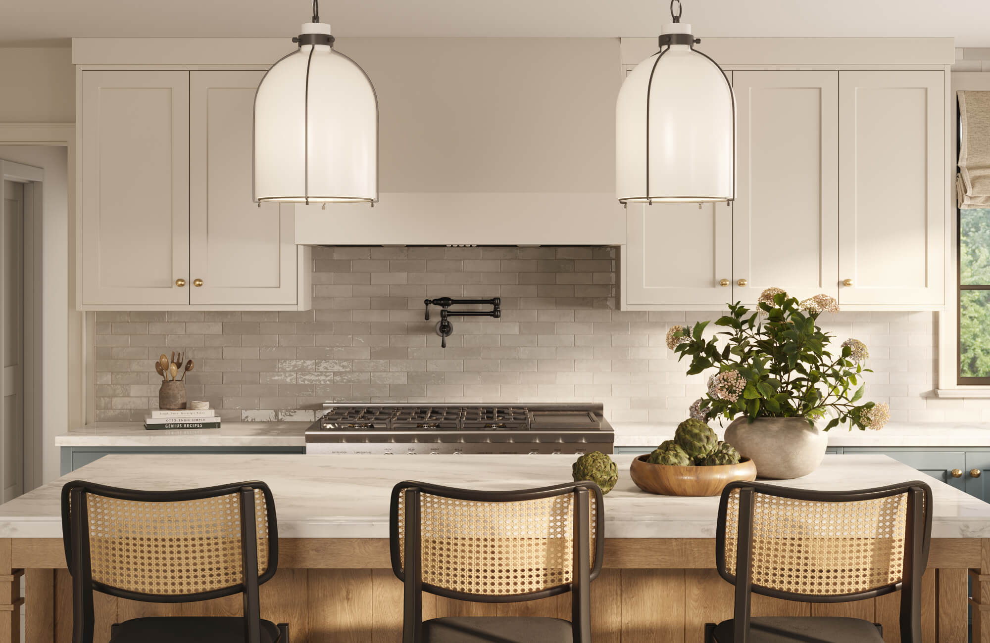 Bright kitchen with marble island seating, woven-back bar stools, cream cabinetry, white subway zellige-style tile backsplash, and oversized glass pendants.