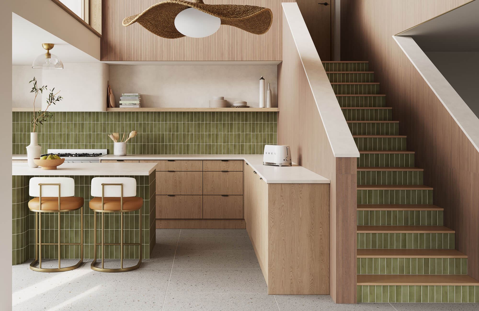 Modern kitchen with light wood cabinetry, green zellige-style tile backsplash and stair risers, marble island seating, and sculptural woven pendant light.