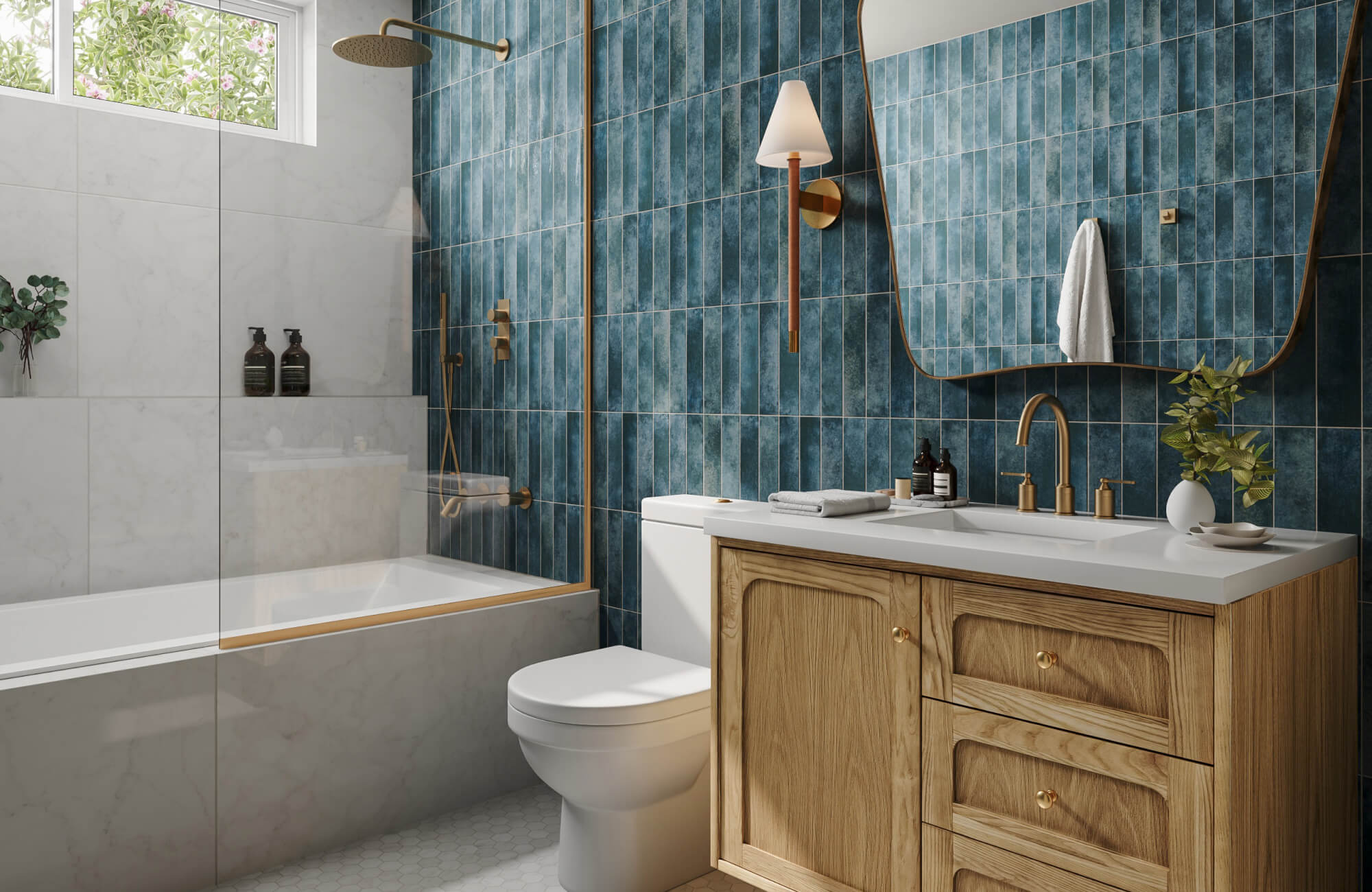 Bathroom with rich blue vertical tiles, warm wood vanity, and brushed brass fixtures, accented by marble look tub walls.