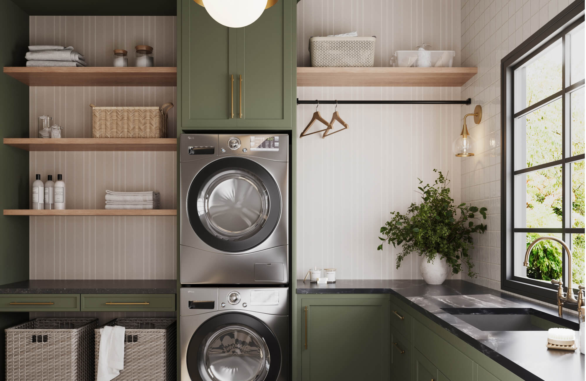 Stylish laundry room with sage green cabinetry, vertical cream wallpaper, sconce, warm wood shelves, and dark stone countertops.