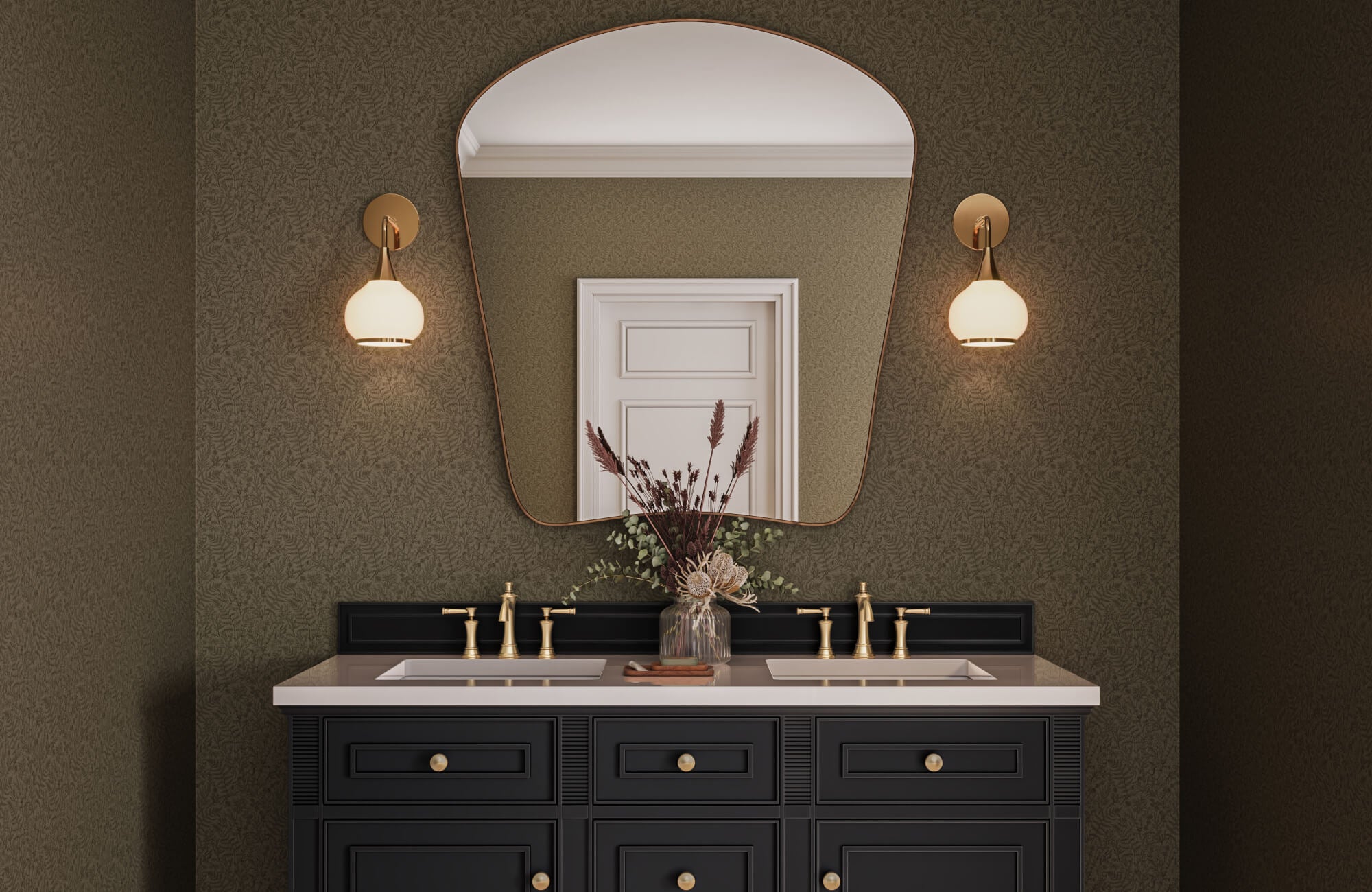 Moody bathroom with textured olive wallpaper, sculptural brass sconces, asymmetrical mirror, and a black double vanity with gold hardware.