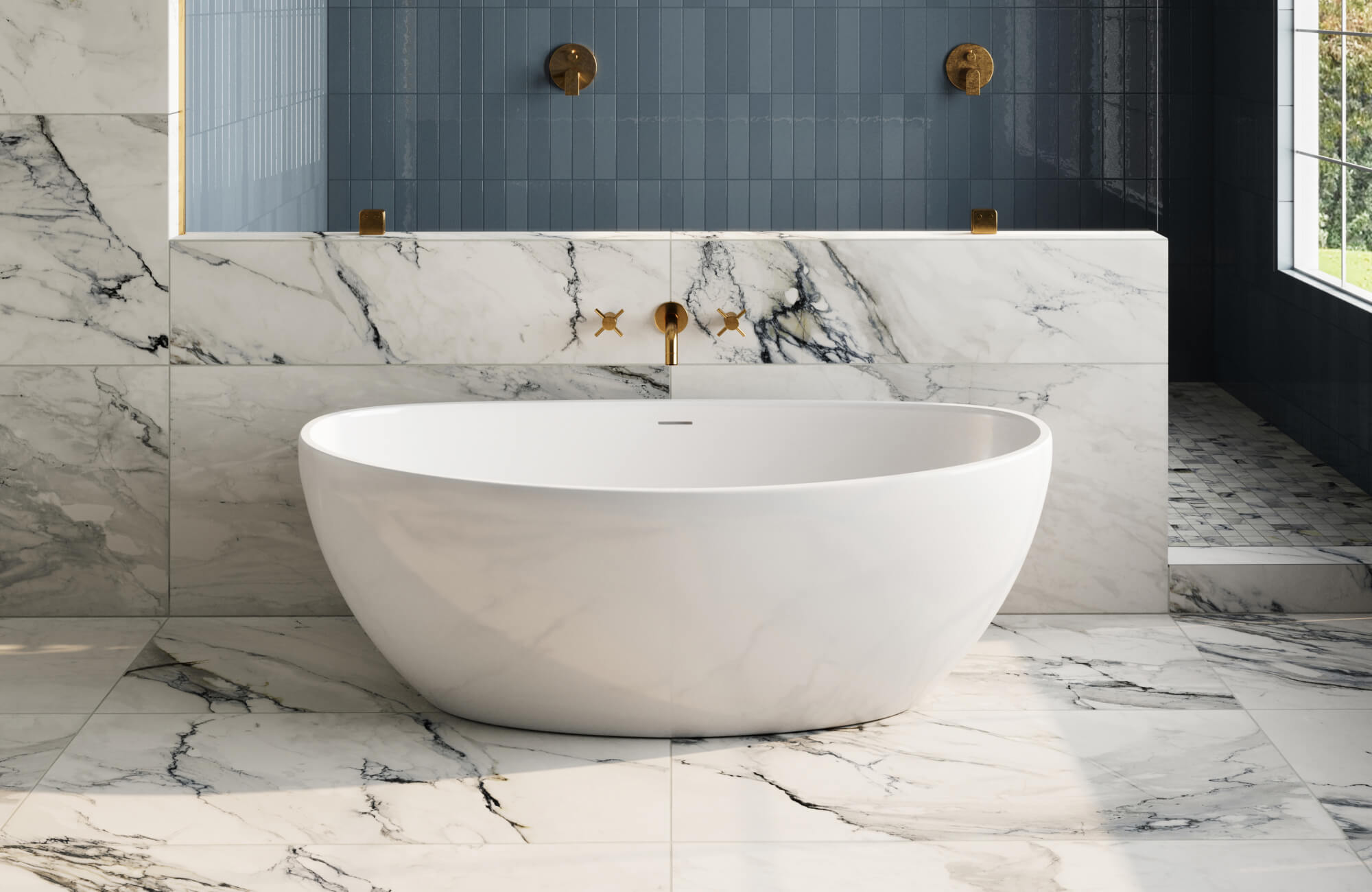null Luxurious bathroom with a freestanding oval tub, white marble look tiles with bold veining, and gold fixtures against a backdrop of deep blue tile.