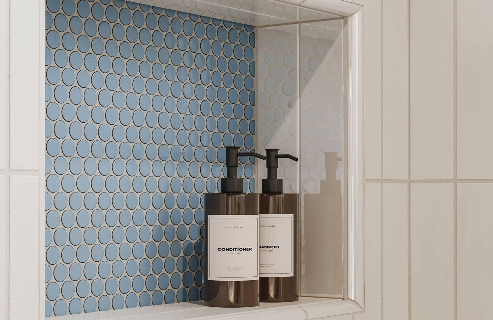 null Shower niche with glossy penny round mosaic tiles, white trim, and sleek amber pump bottles for shampoo and conditioner.
