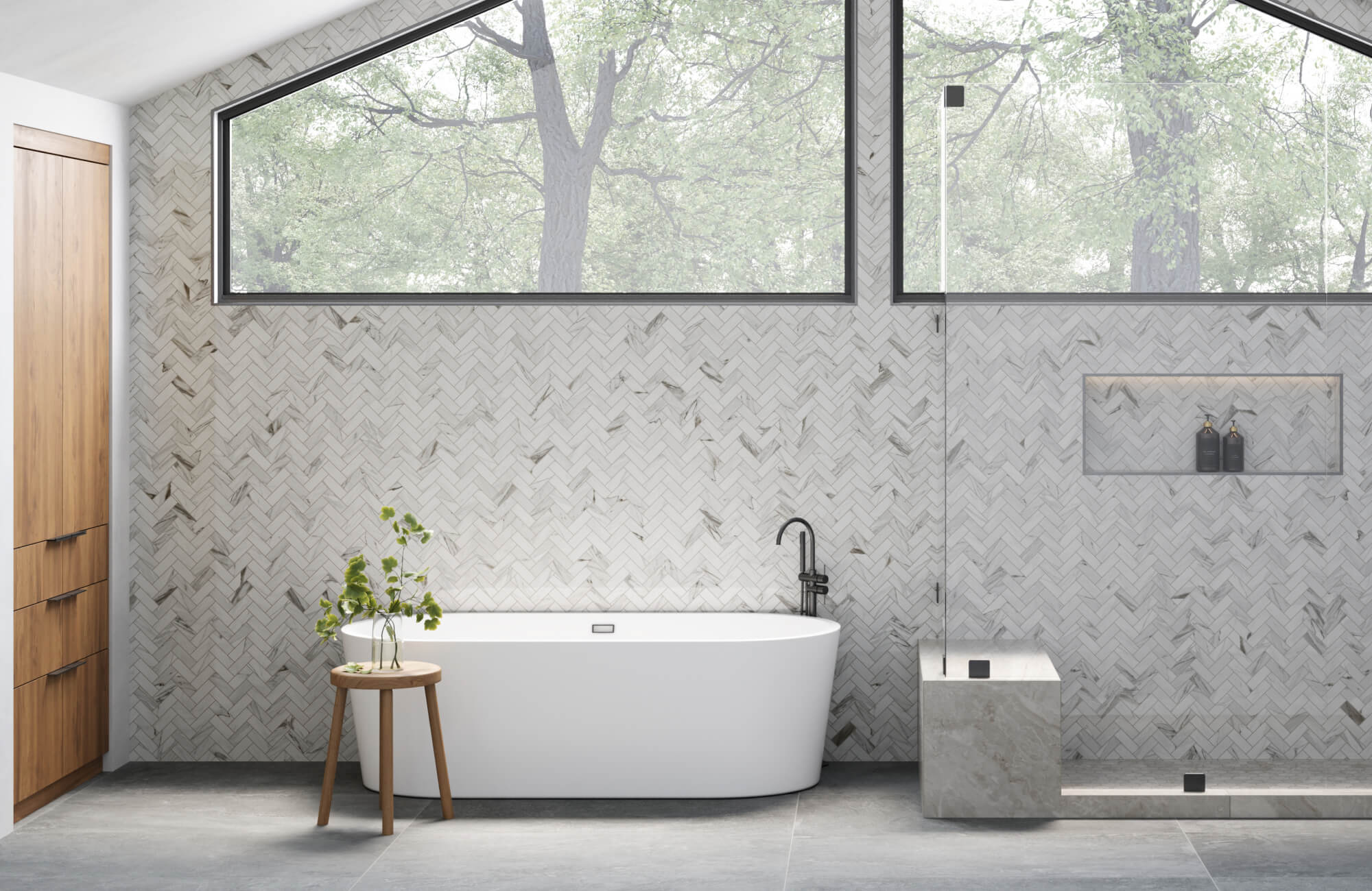 null Spa-like bathroom with a freestanding tub, herringbone marble look tile floor, and expansive windows framing lush green trees.