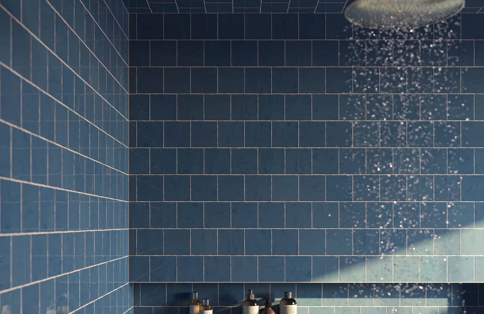 null Modern bathroom renovation showcasing deep blue subway wall tiles with clean grout lines, a rainfall showerhead, and subtle lighting that creates a calm, contemporary shower space.