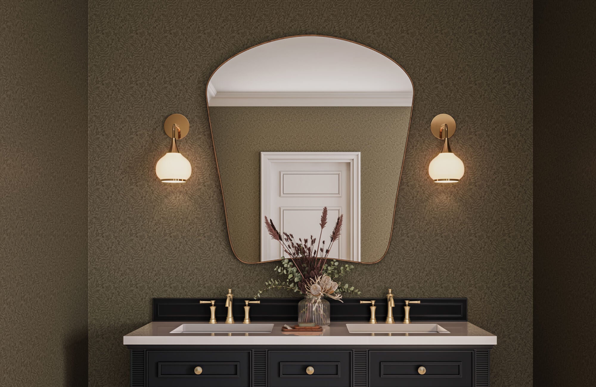 Moody bathroom vanity with dual sinks, brass fixtures, an arched mirror, and textured olive green wallpaper.