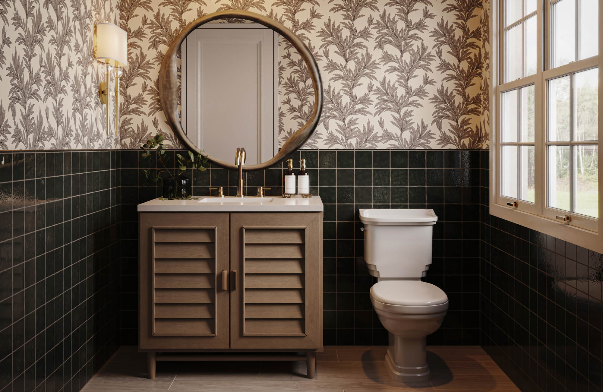 Chic powder room with dark green square tile wainscoting, botanical wallpaper, and a round brass mirror.