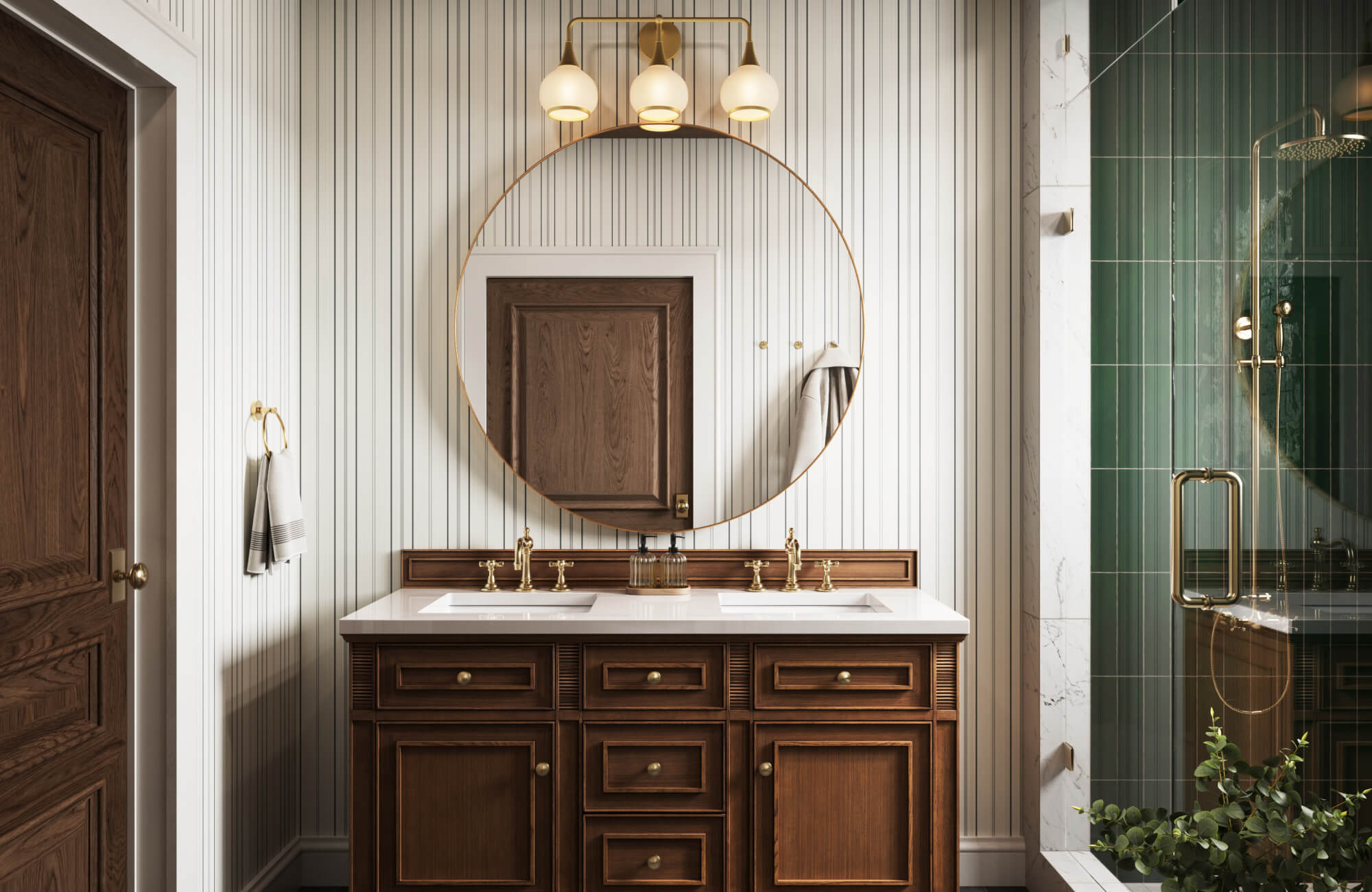 Classic bathroom with rich wood double vanity, round brass mirror, striped wallpaper, and green tiled shower.
