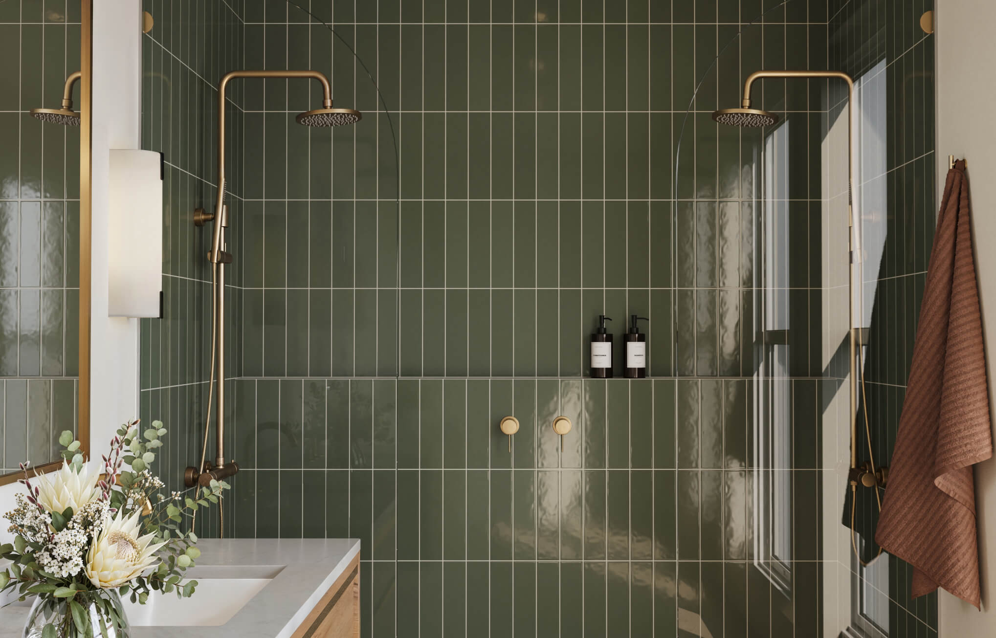 null Glossy green vertical stacked subway tiles stretch the walls visually in a modern double shower with gold fixtures.