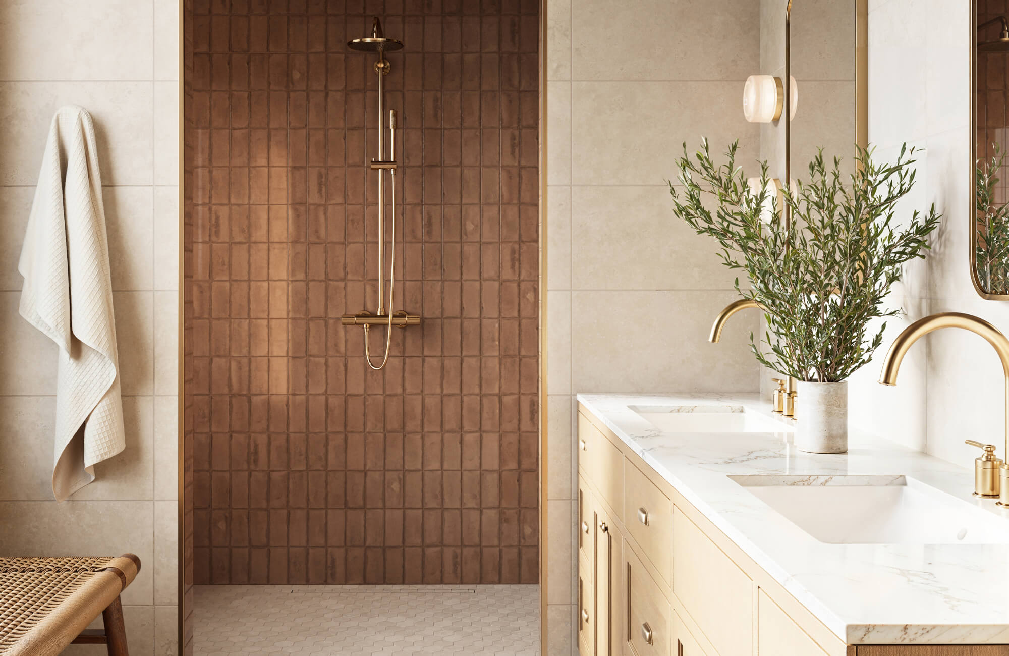 Walk-in shower with warm brown square shower wall tiles, small white mosaic shower floor tile installation, and neutral beige bathroom tile layout.