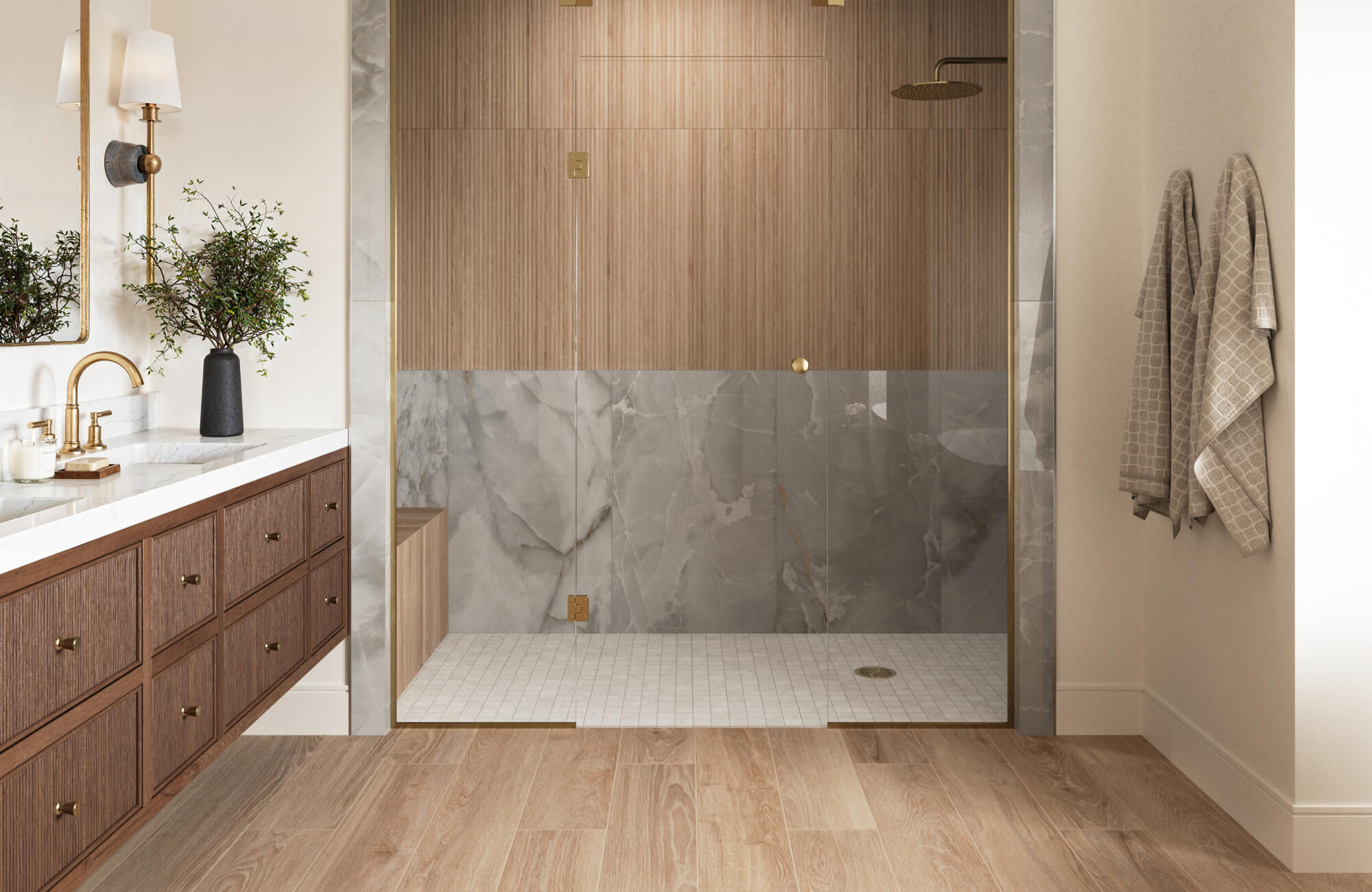 Walk-in shower with mixed tile sizes, vertical light brown wood-look shower wall tile installation, gray marble wall tiles, and small white mosaic shower floor tile layout.