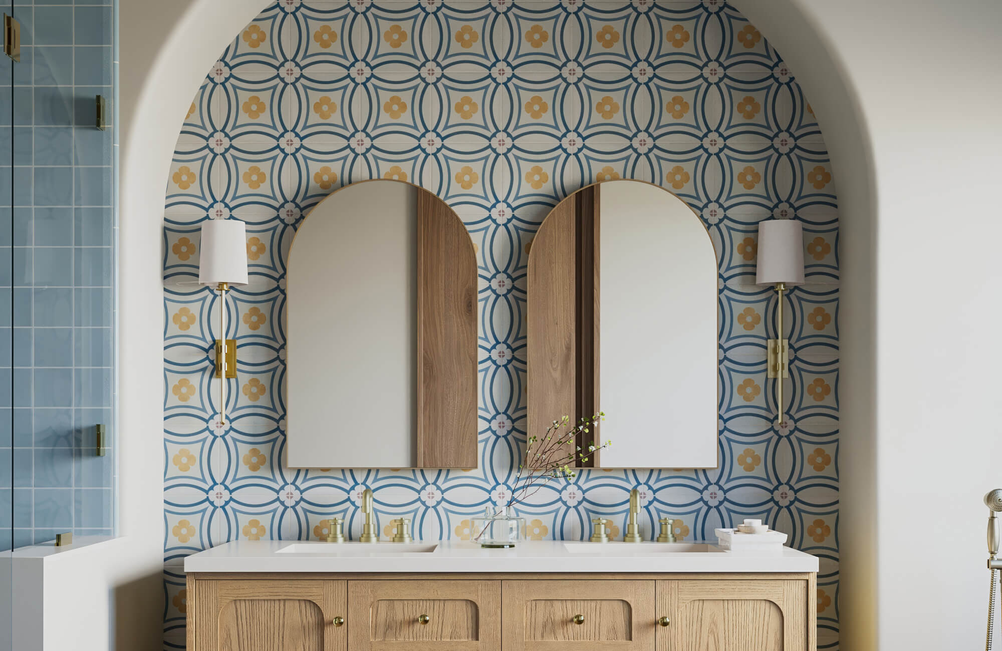 Stylish bathroom showcasing ideal mirror placement with twin arched mirrors, floral tile backdrop, and wood vanity.