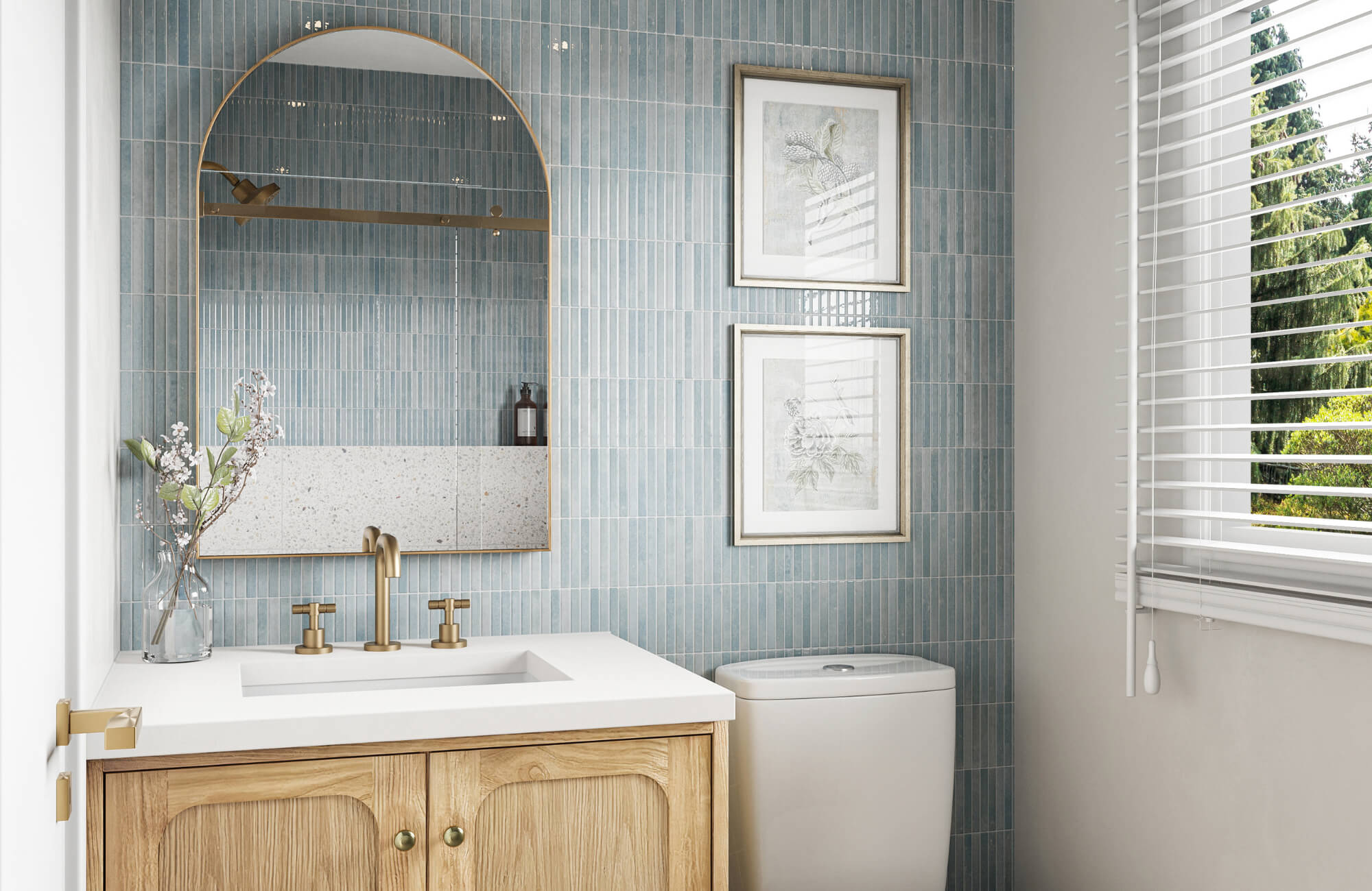 null Bright bathroom with a gold-framed arched mirror, wood vanity, light blue vertical tile, and brass fixtures for a fresh, airy design.