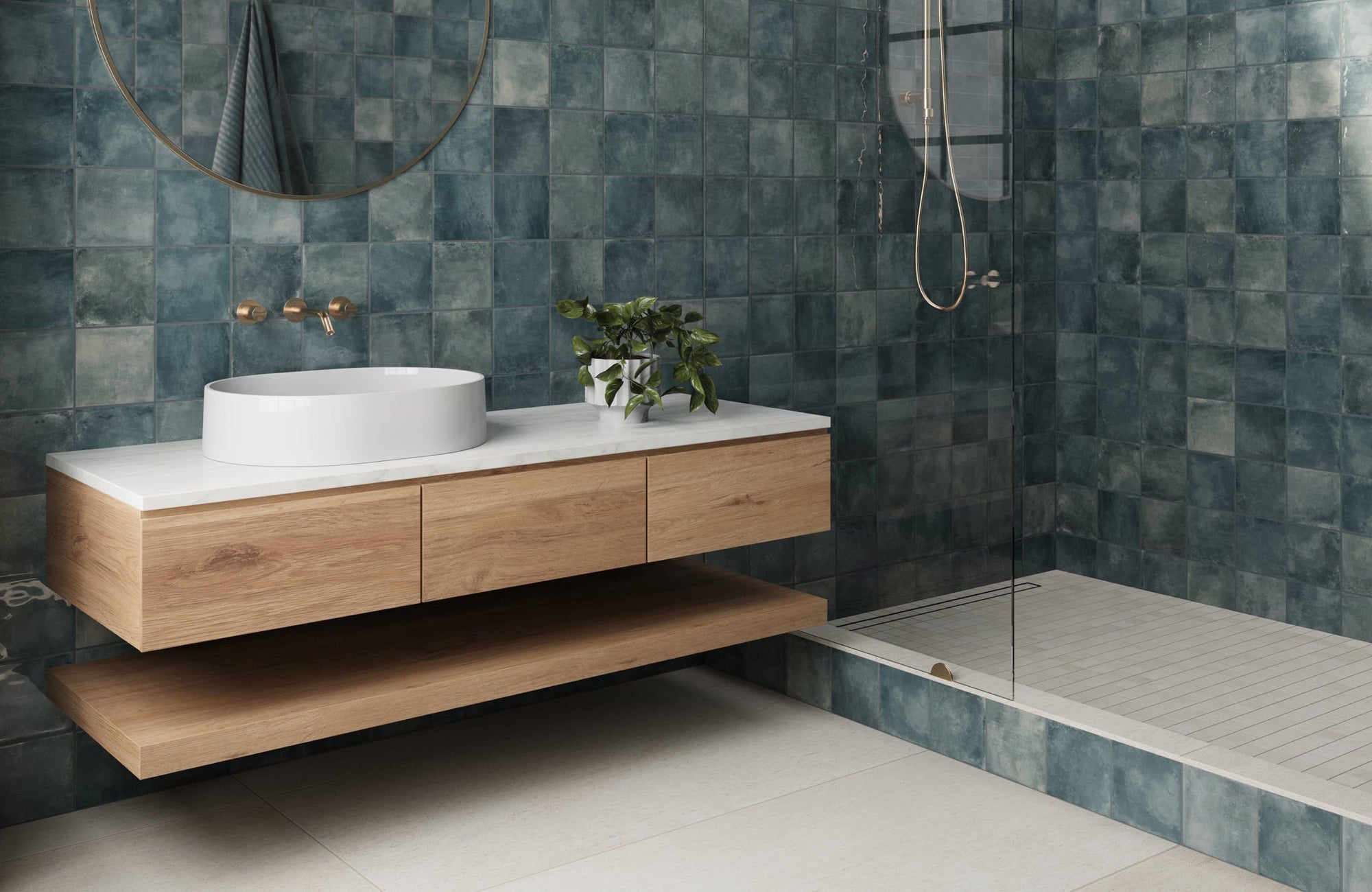 null Minimalist floating vanity with soft wood finish and open lower shelf, styled against textured blue wall tiles.