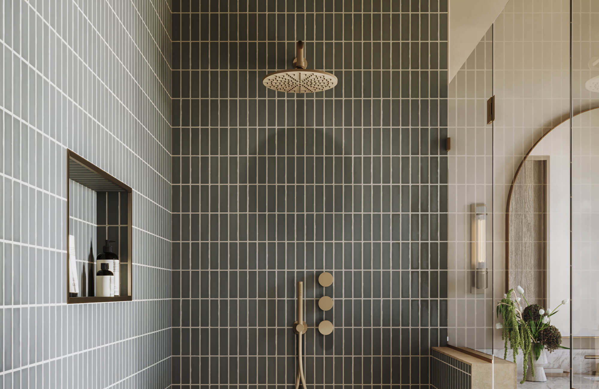 Vertical green ceramic shower tiles with pale grout lines and a modern gold rainfall showerhead are seen in a minimalist bathroom with glass walls.