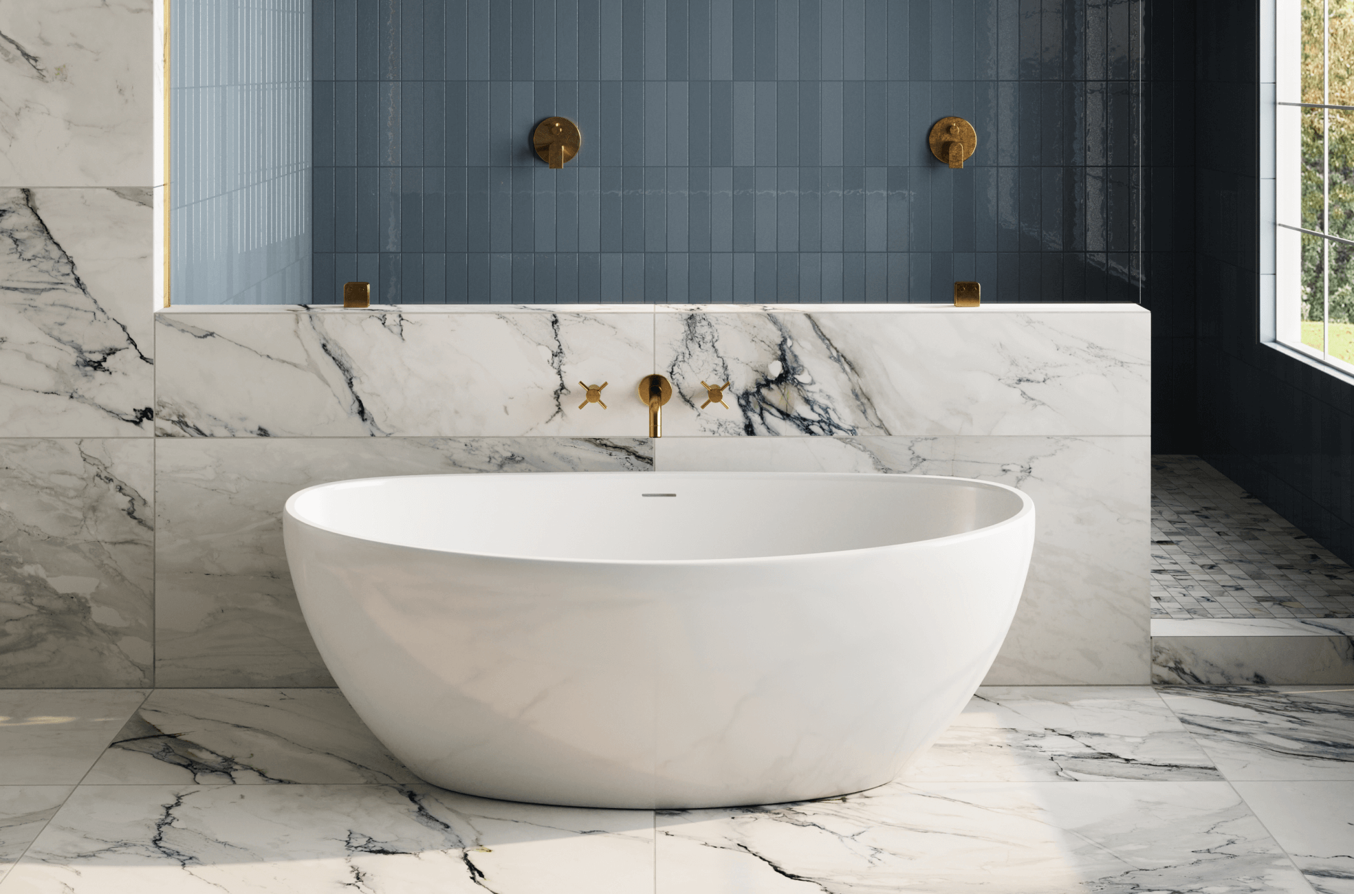 null Luxurious bathroom with marble look tiles featuring bold veining, a freestanding white tub, and gold fixtures, complemented by a striking navy blue subway tile backdrop.