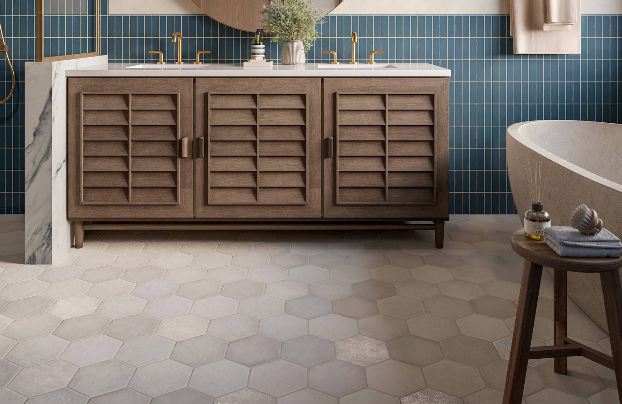 null Modern bathroom with louvered wood vanity, brass fixtures, blue vertical tile backsplash, and neutral hexagon floor tiles.