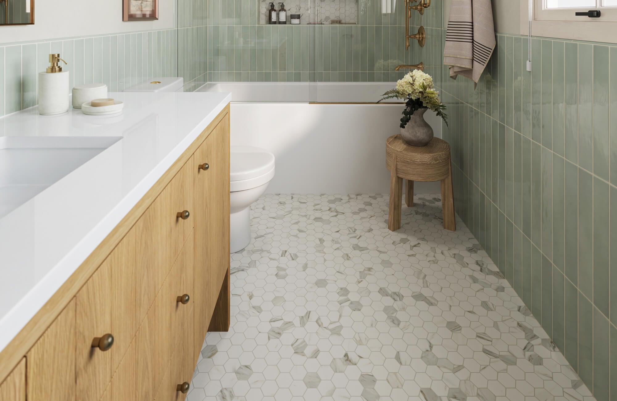 null Bathroom with light wood vanity, sage green vertical wall tiles, and white hexagon marble mosaic floor leading to a tub-shower.