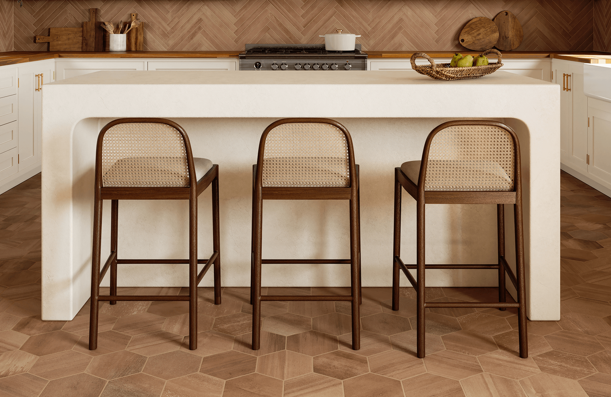 null Kitchen island with three woven-back bar stools, set on warm hexagon tile flooring and framed by a herringbone backsplash.