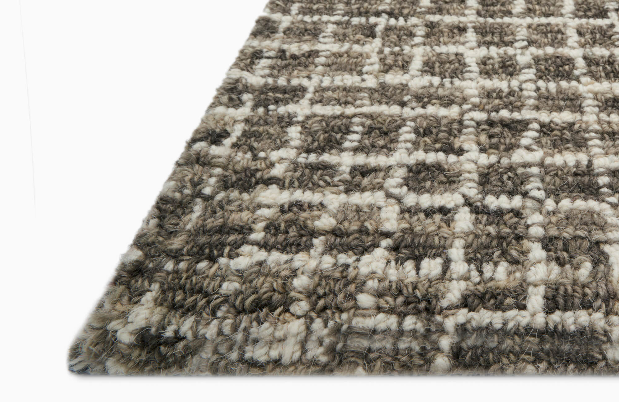 Decorative runner rug with muted beige and green tones, adding texture and comfort to a modern kitchen floor.