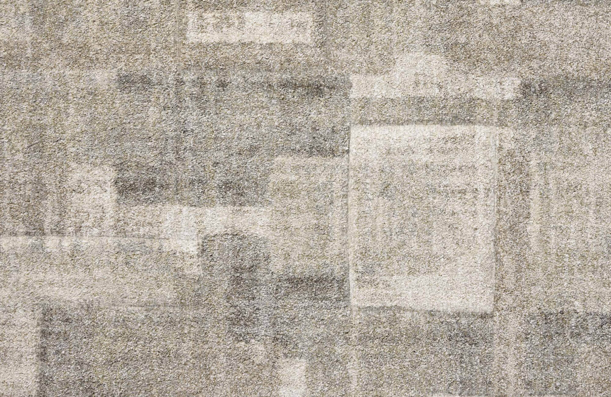 A low-pile polypropylene rug with an abstract geometric pattern in soft neutral tones, adding depth and modern elegance to any space.