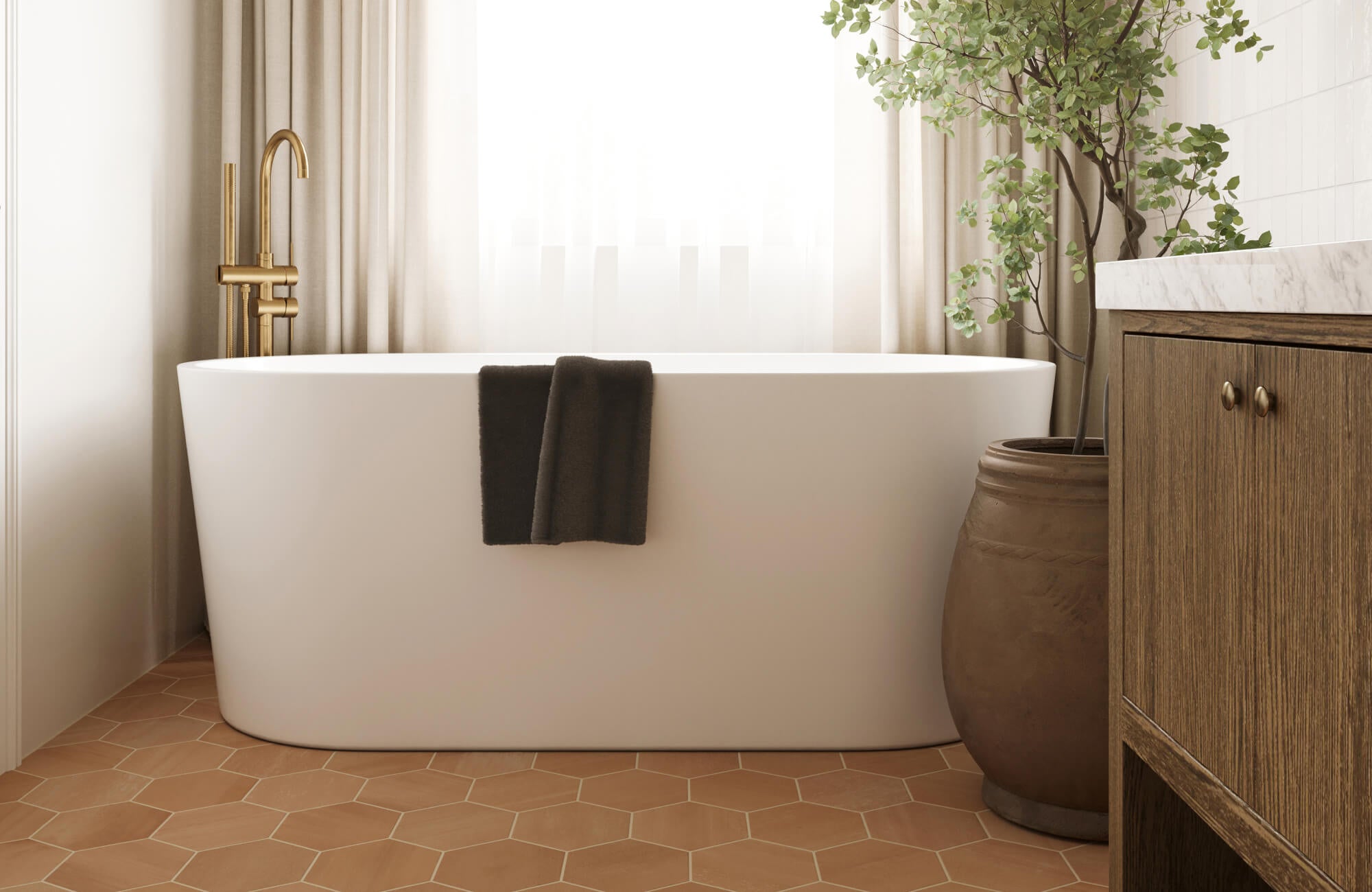 null Warm terracotta floor tiles in a hexagon pattern ground this light-filled bathroom, featuring a freestanding tub and rustic wood vanity.