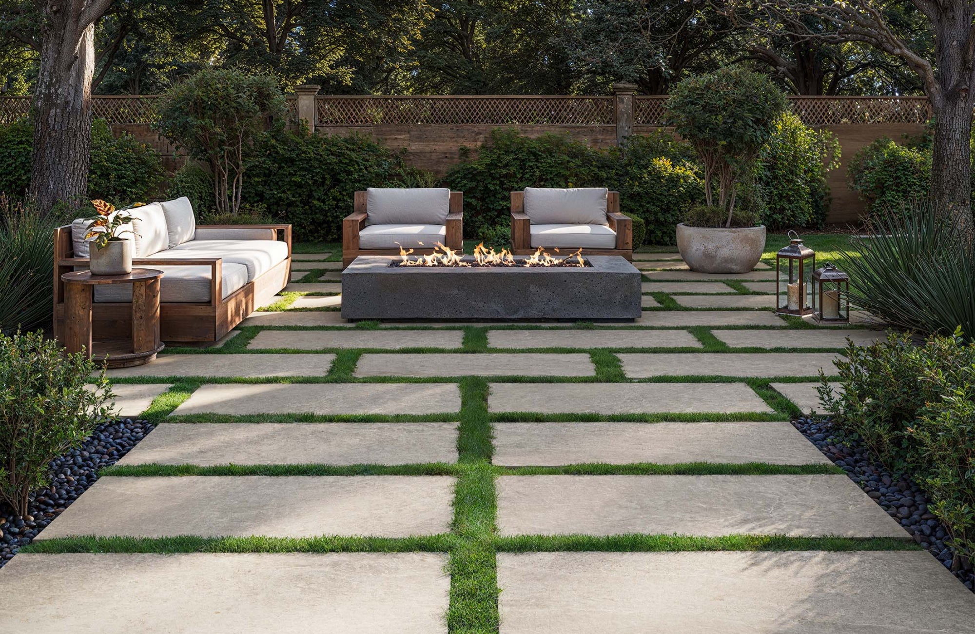 null Outdoor patio with large square pavers set in grass, creating a modern geometric layout for seating and a fire pit.