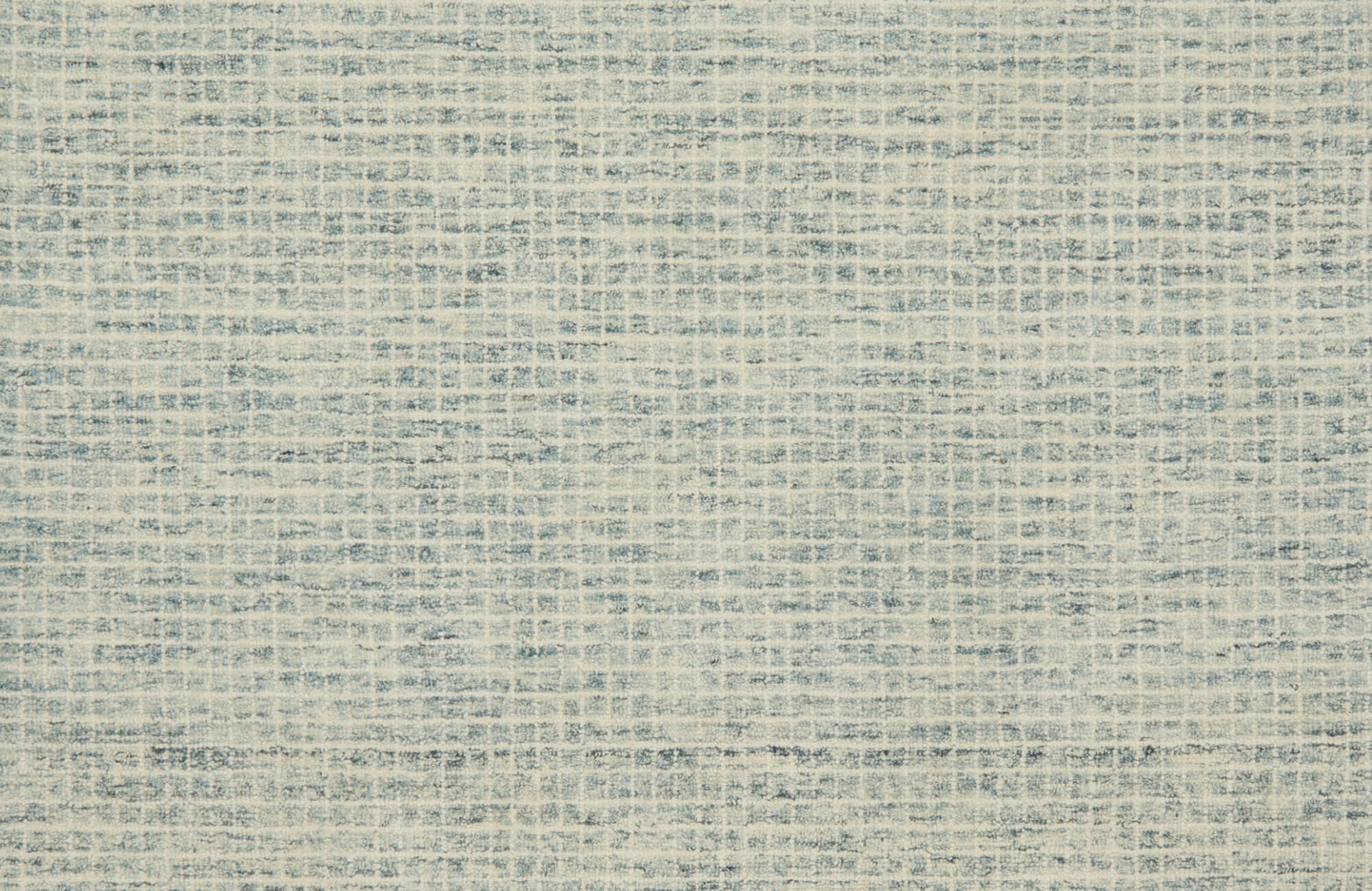 Blue and cream wool rug with a lightly textured pattern, giving it a relaxed look that blends nicely into everyday spaces.