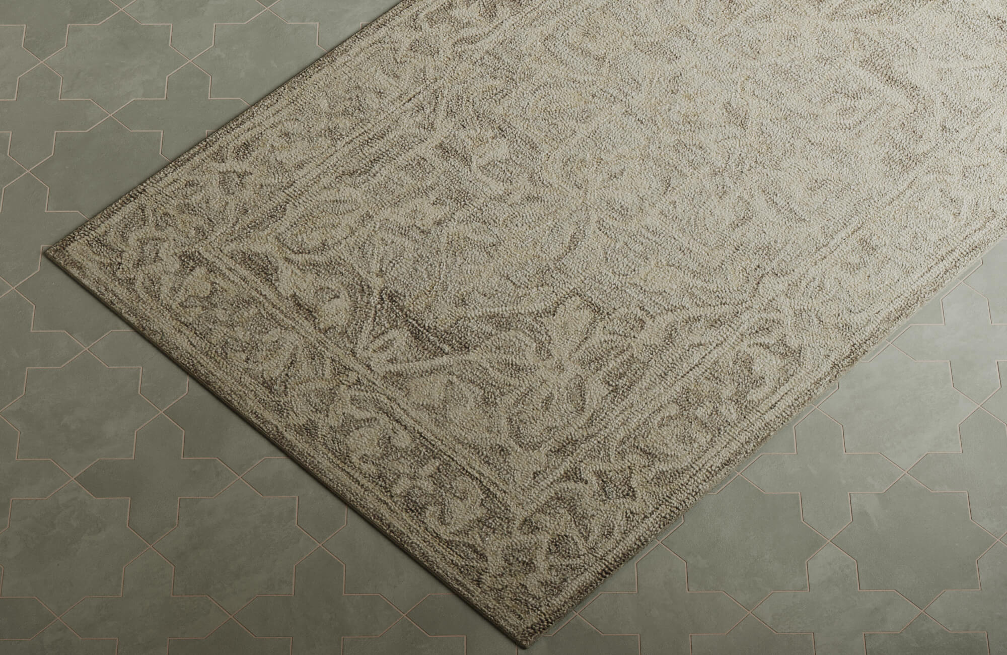 A gray wool rug rests over green patterned tiles, softening the look and adding a cozy layer to the space.