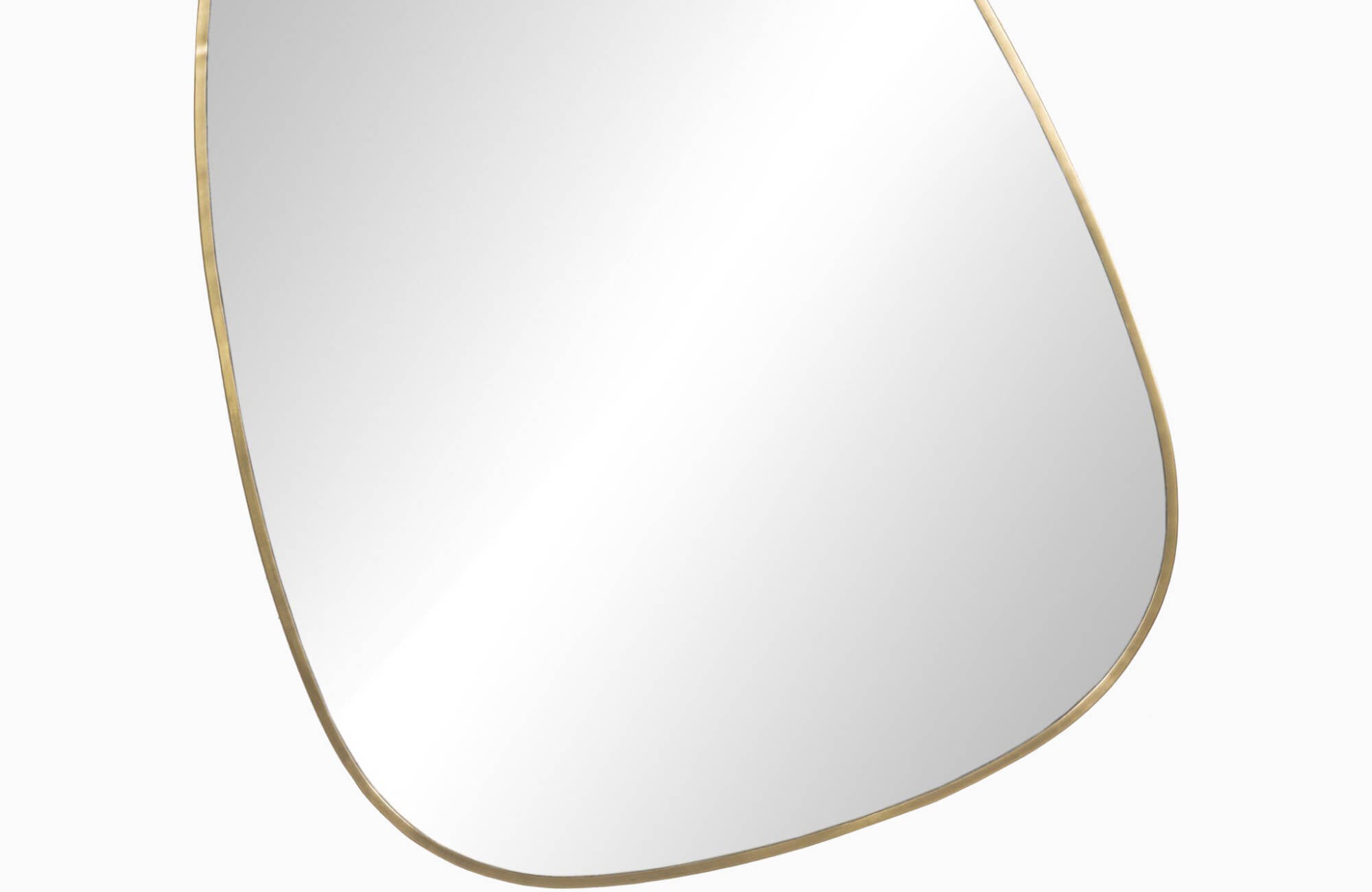 null Asymmetrical bathroom mirror with a softly curved, organic silhouette framed in brushed brass, offering a modern yet fluid accent ideal for contemporary interiors.