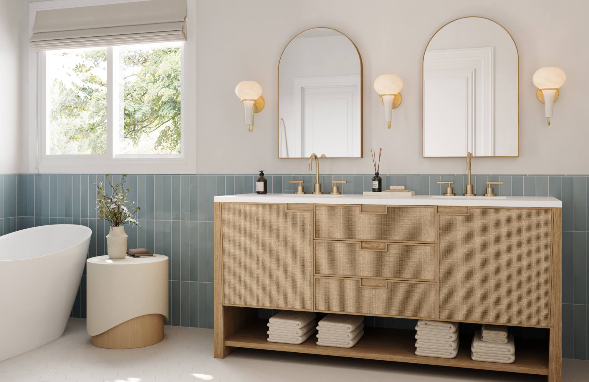 null Bright bathroom double vanity featuring a natural wood cabinet with rattan-textured fronts, gold fixtures, arched mirrors, and soft blue wall tiles that create a serene and sophisticated coastal-inspired aesthetic.