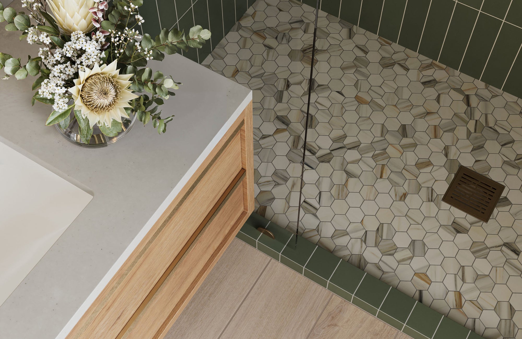 null Shower with hexagon marble mosaic floor tile in mixed warm tones, combining visual interest with natural stone texture.