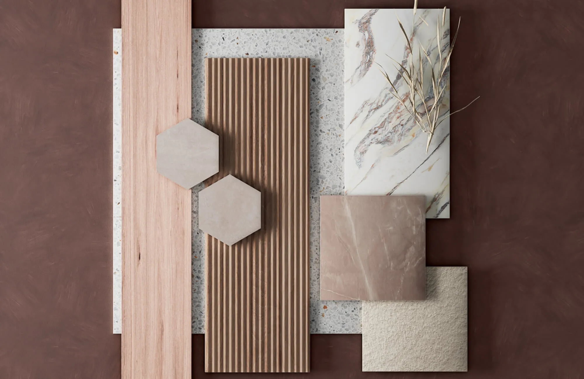 Flat lay of mixed materials featuring the looks of wood slats, terrazzo, marble, textured stone, and neutral hexagon tiles.