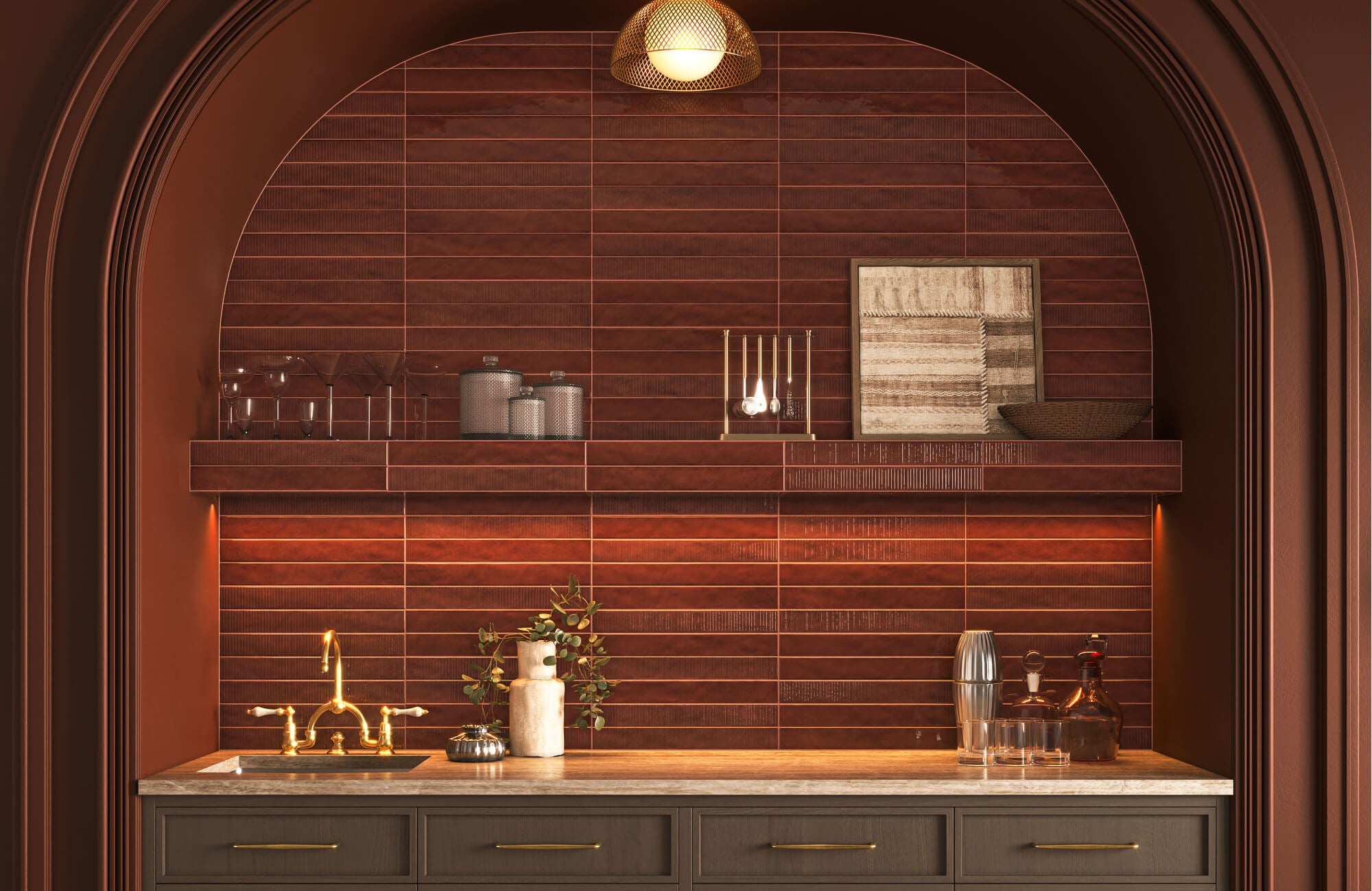 null Moody bar nook with glossy burgundy subway tiles, arched alcove shelving, wall art, and warm brass accents.