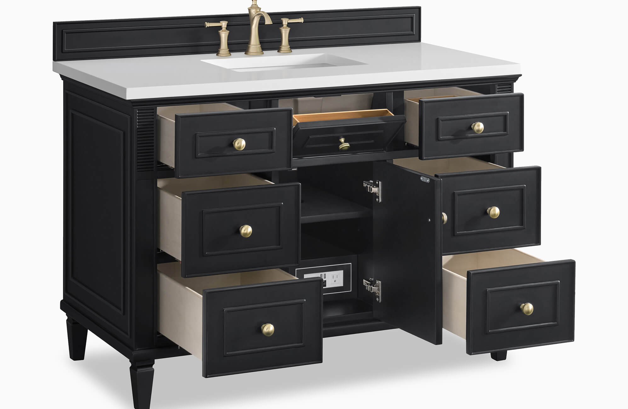Black bathroom vanity with white countertop, brass faucet, and multiple open drawers showing ample storage.