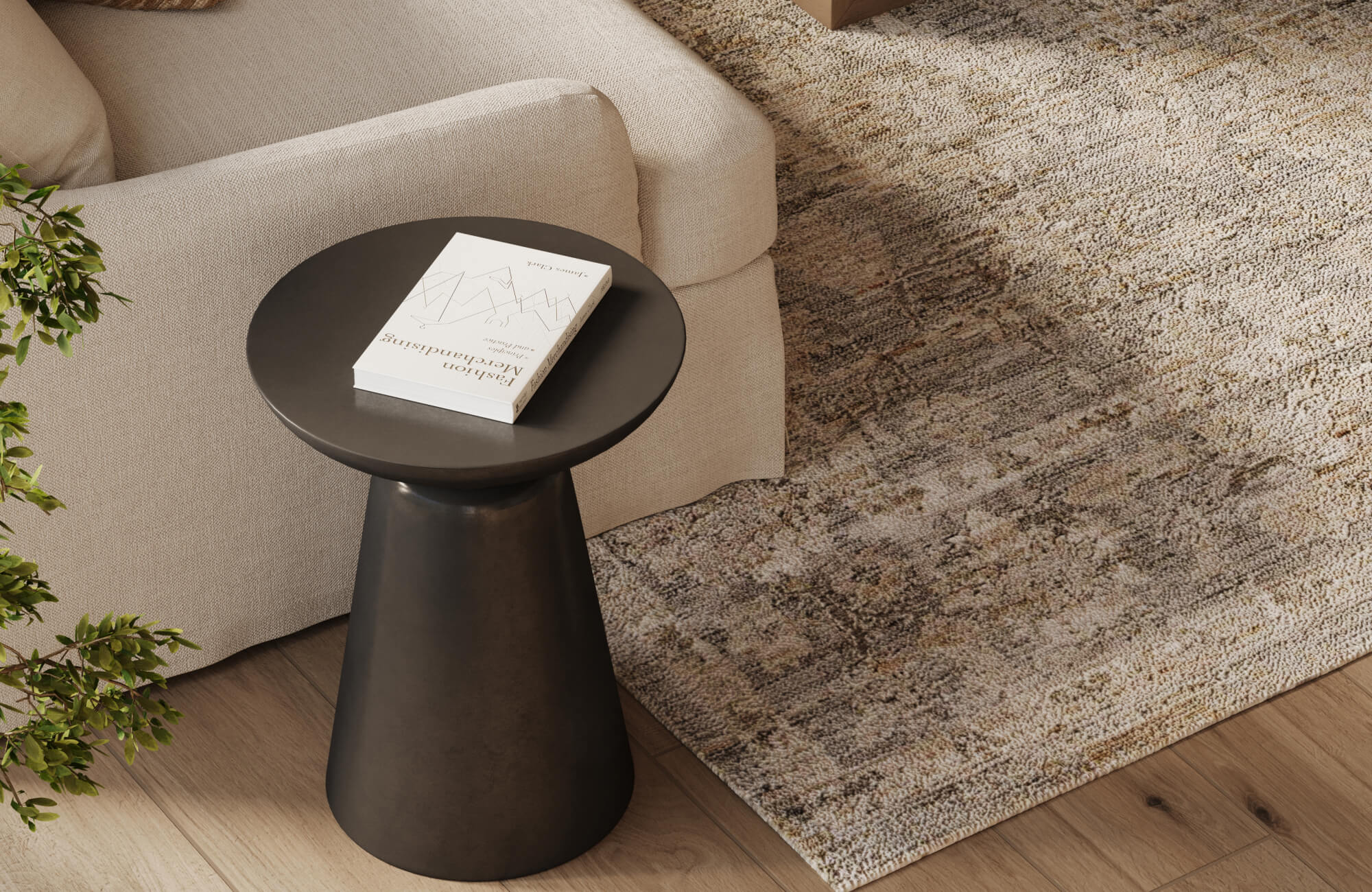 Cozy corner with a beige sofa and modern black side table, complemented by a distressed brown rug that adds warmth and vintage character.