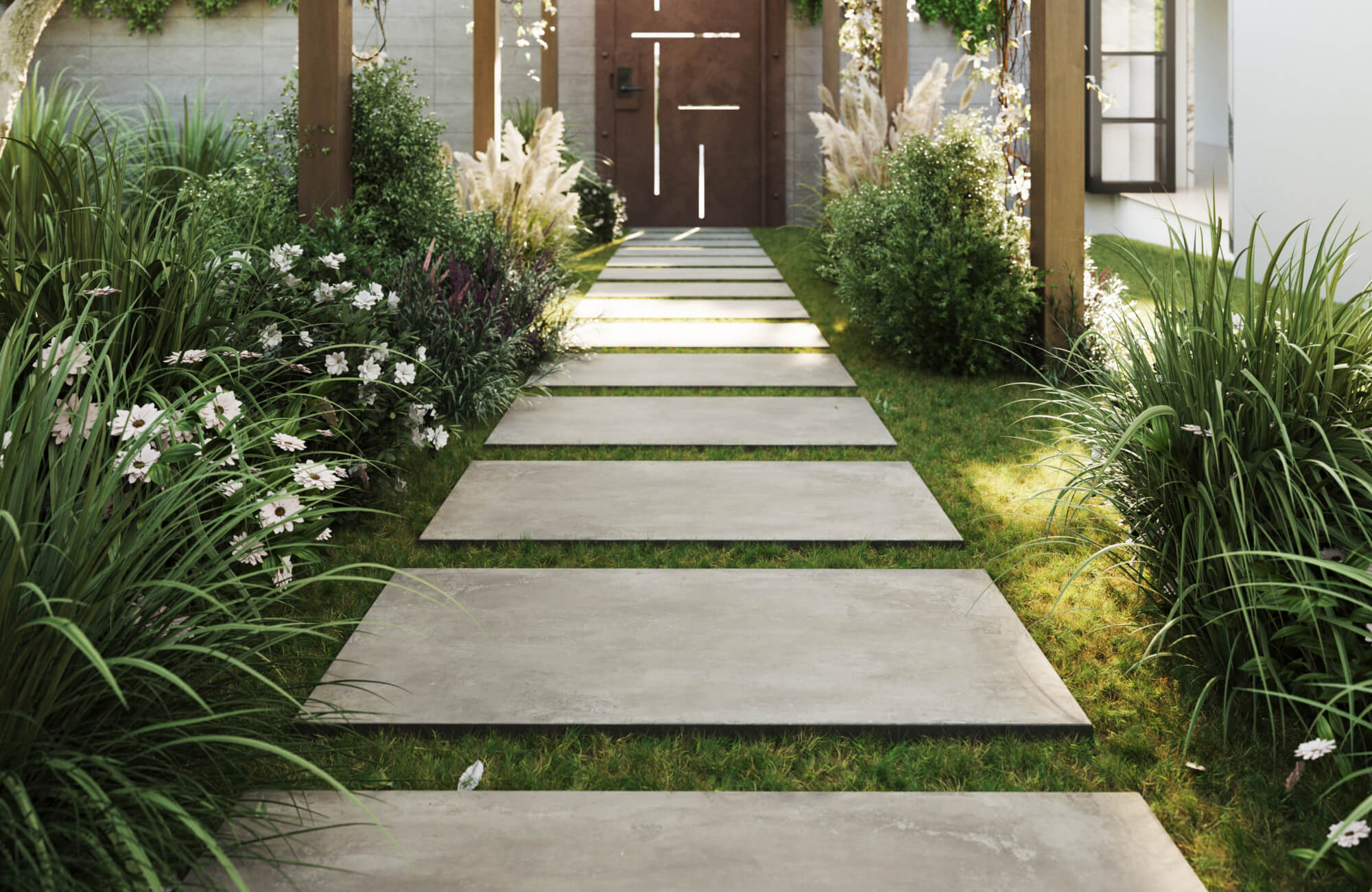 null Modern garden walkway with large format porcelain pavers set in grass, framed by lush greenery and blooming white flowers.