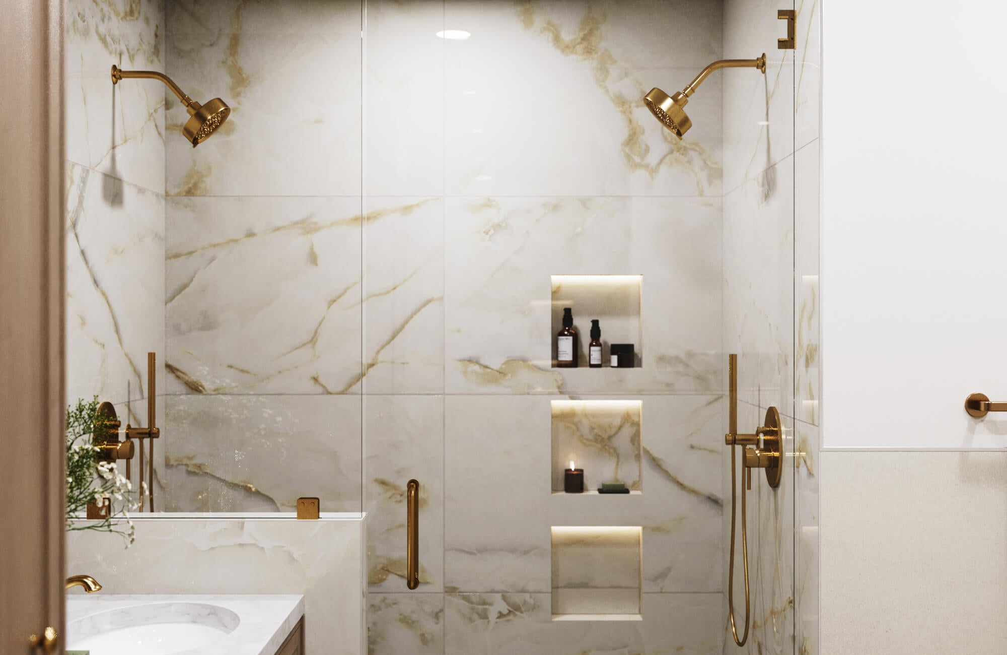 Elegant shower with polished marble-look large bathroom tiles and built-in illuminated wall niches.