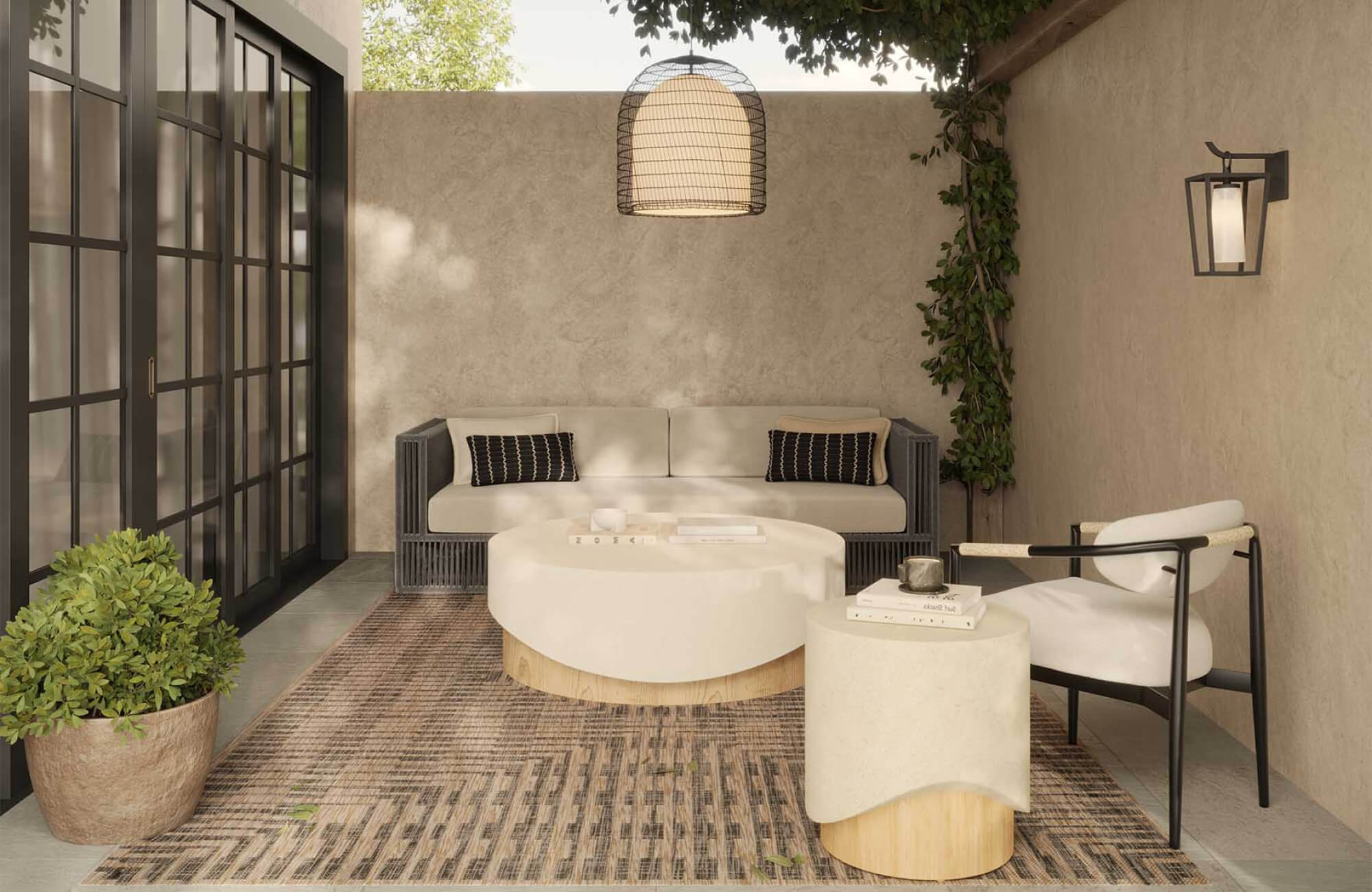 Outdoor patio seating area with a neutral-toned polypropylene rug, cushioned sofa, round coffee table, and accent chair under soft natural light.