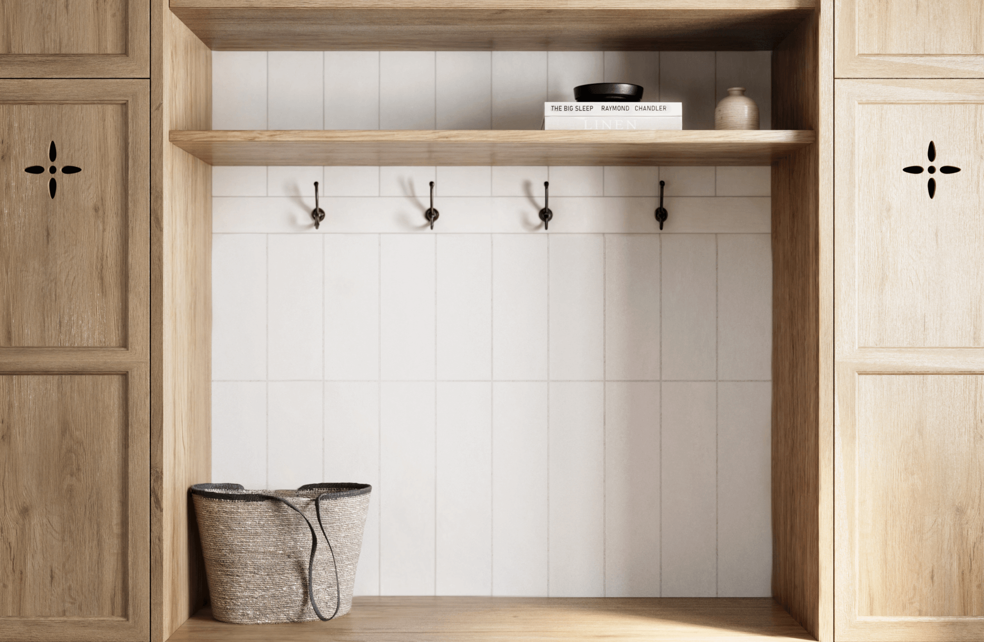 null Cozy mudroom with vertical white subway tiles, warm wood cabinetry, and black hooks, creating a functional yet inviting storage space.