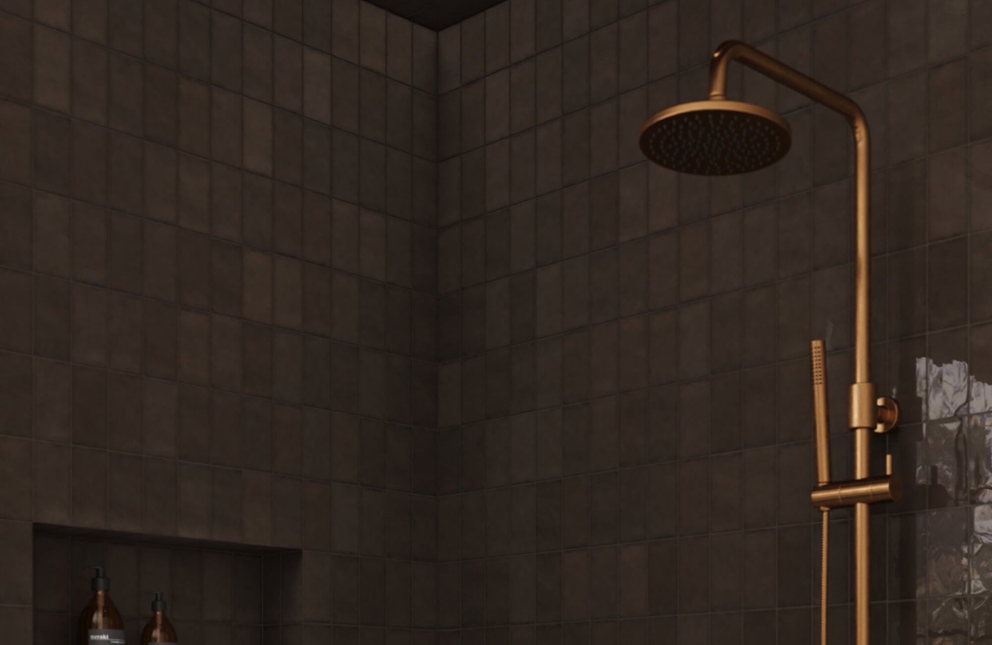 Matte black subway tiles with a thin black grout color in a shower space with a sleek brass rainfall showerhead and built-in niche for toiletries.
