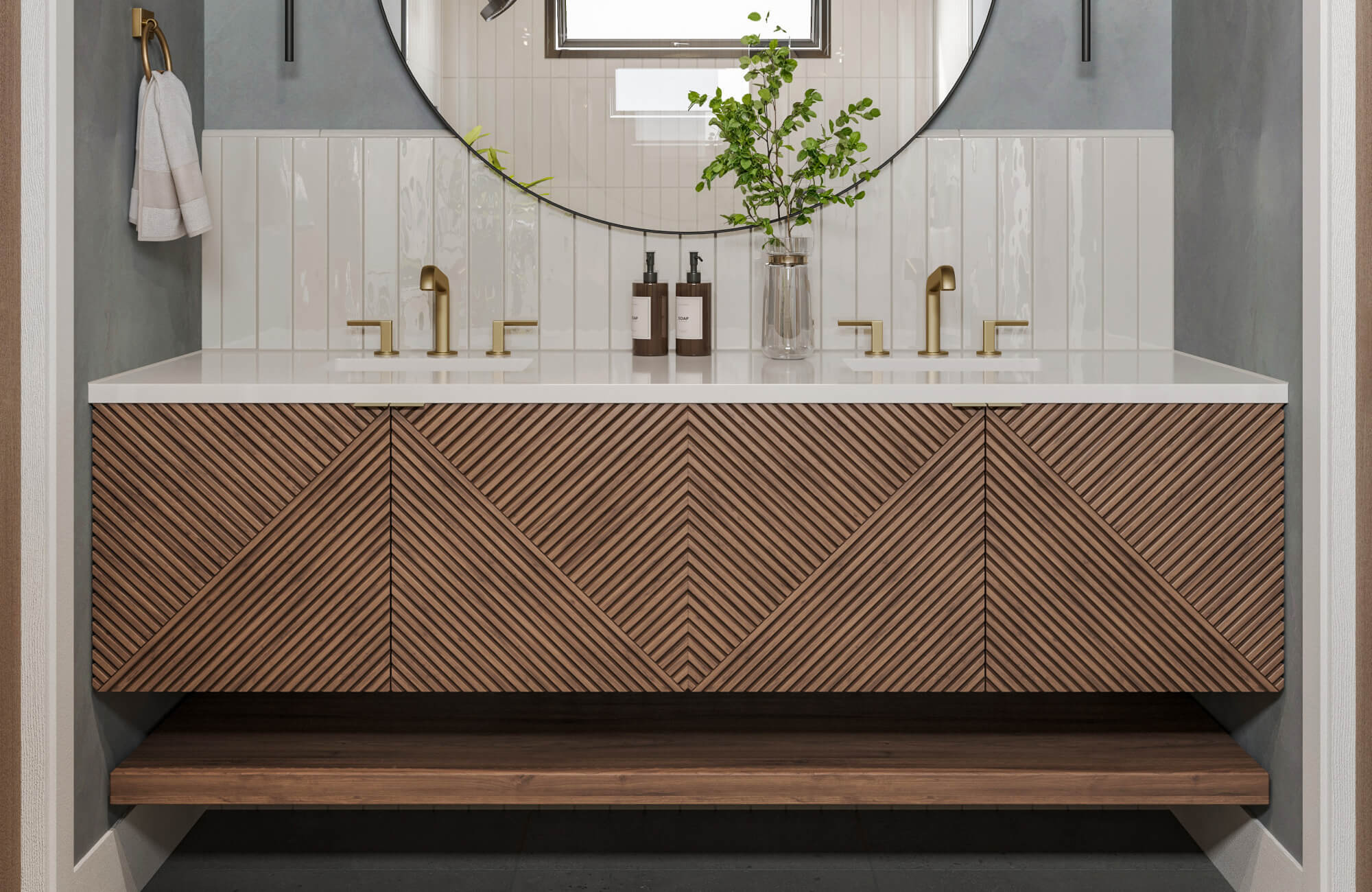 null Modern wood vanity with striking chevron slat design, paired with brushed brass fixtures and glossy vertical tiles.