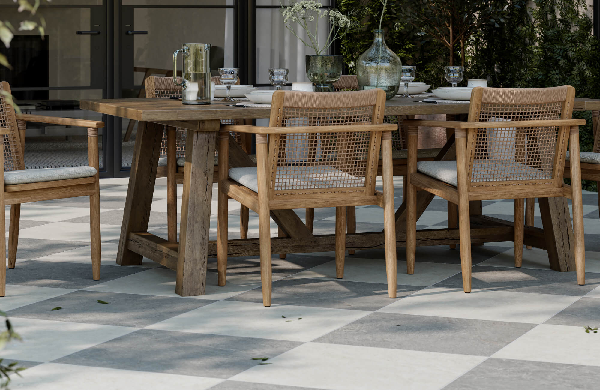 null Close-up of rustic wooden dining set on soft grey and cream checkerboard tiles, perfect for elegant outdoor living.