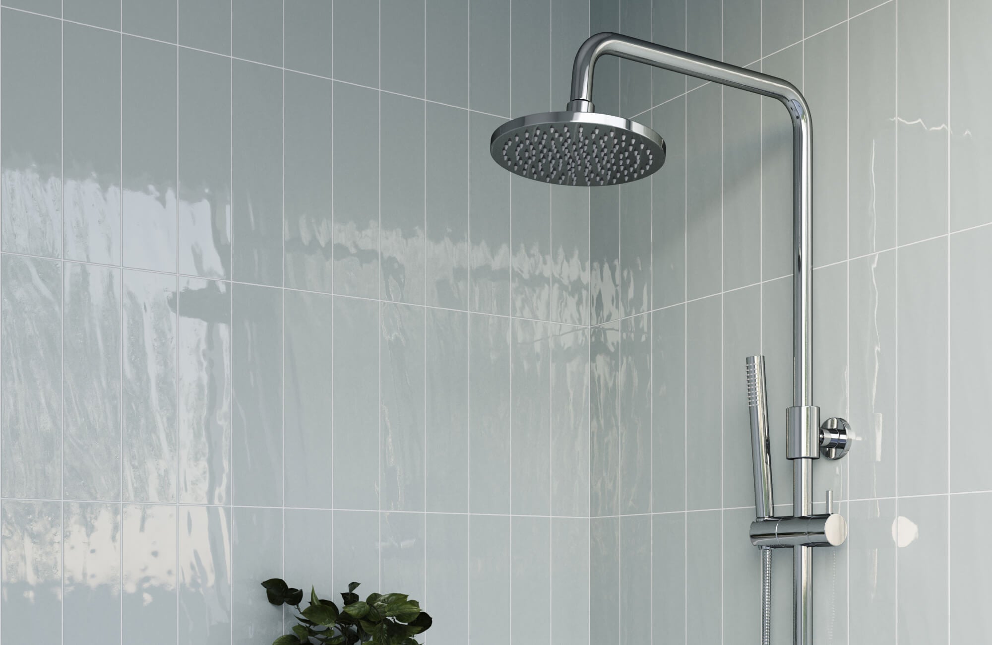 null Modern shower with glossy light blue subway tiles, featuring sleek chrome fixtures and a touch of greenery for a refreshing and contemporary look.