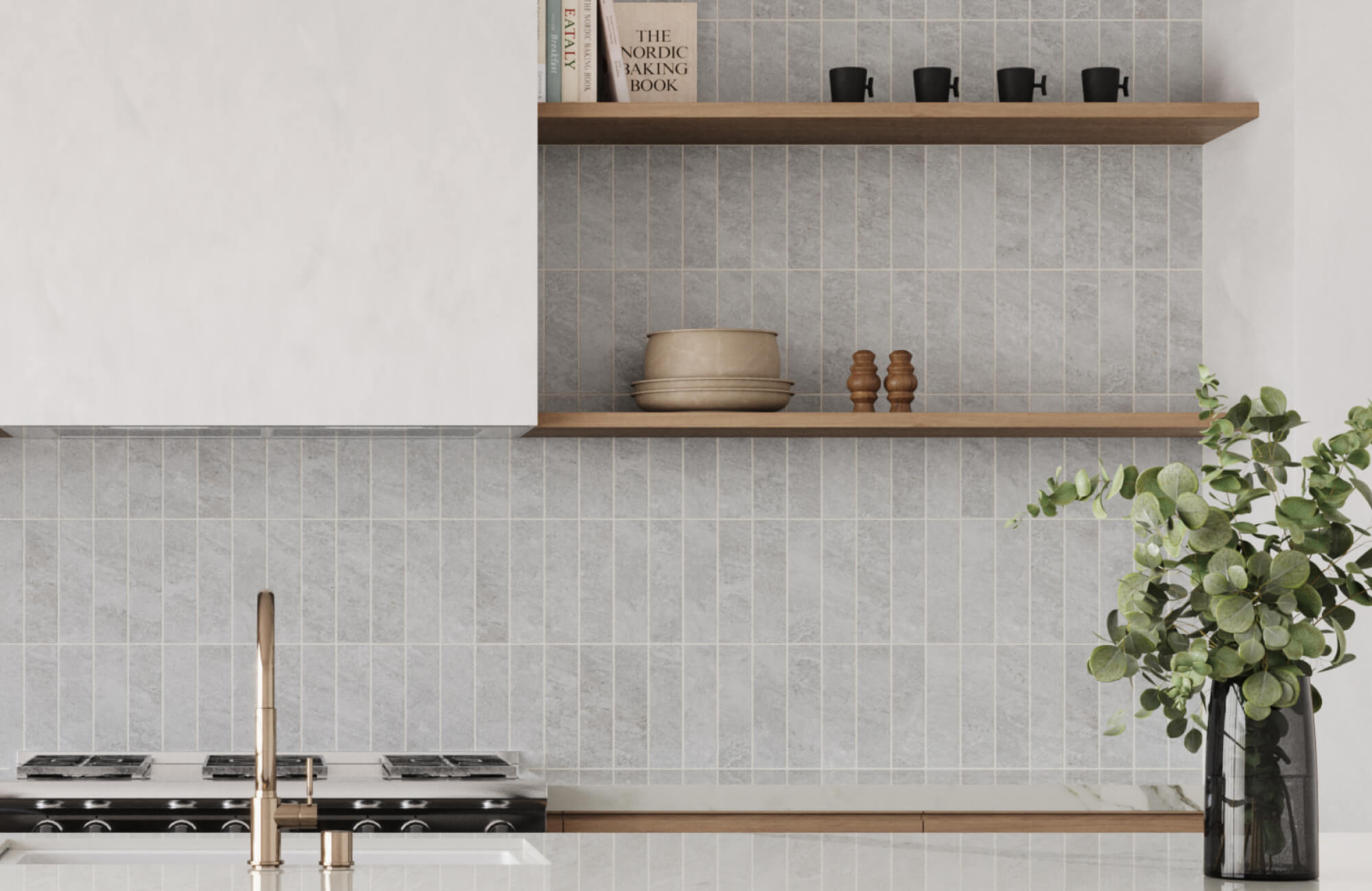 Modern kitchen with small light gray tile backsplash in a grid layout, featuring a matte stone-look finish, open wood shelving, white cabinetry, and brass fixtures.