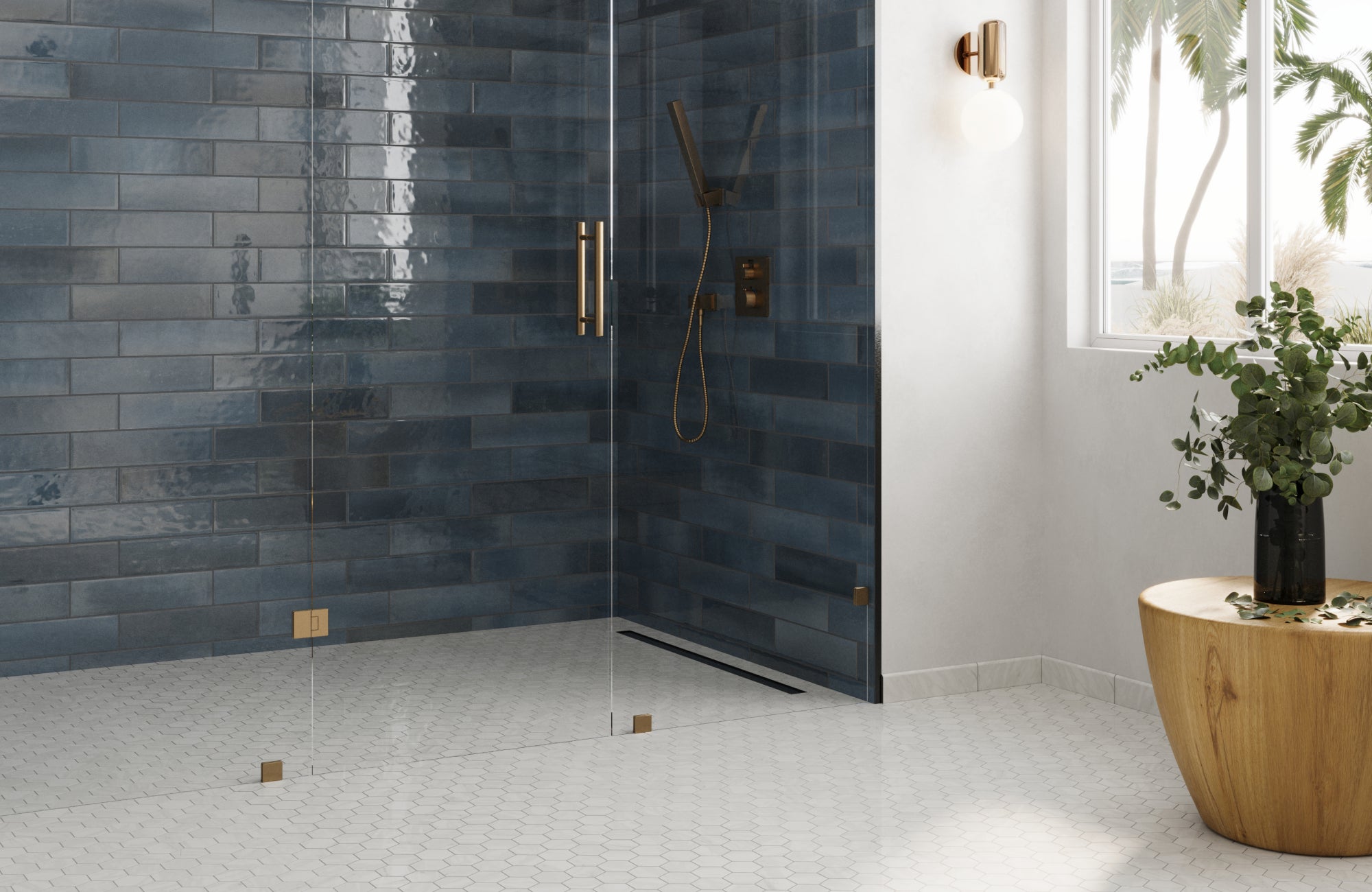 null White small hex tile shower floor creating a clean, bright look against dark blue wall tiles and glass enclosure.