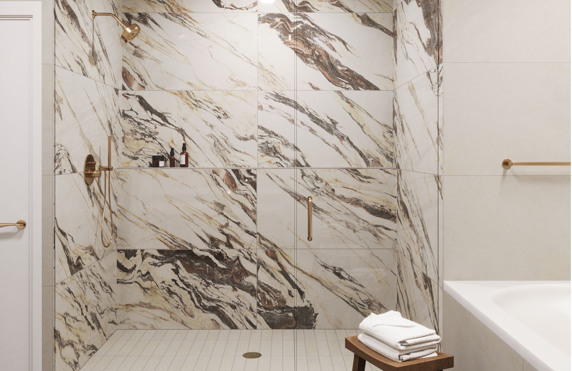 Marble-look porcelain shower walls with dramatic veining paired with gold fixtures for a luxurious spa-like feel.