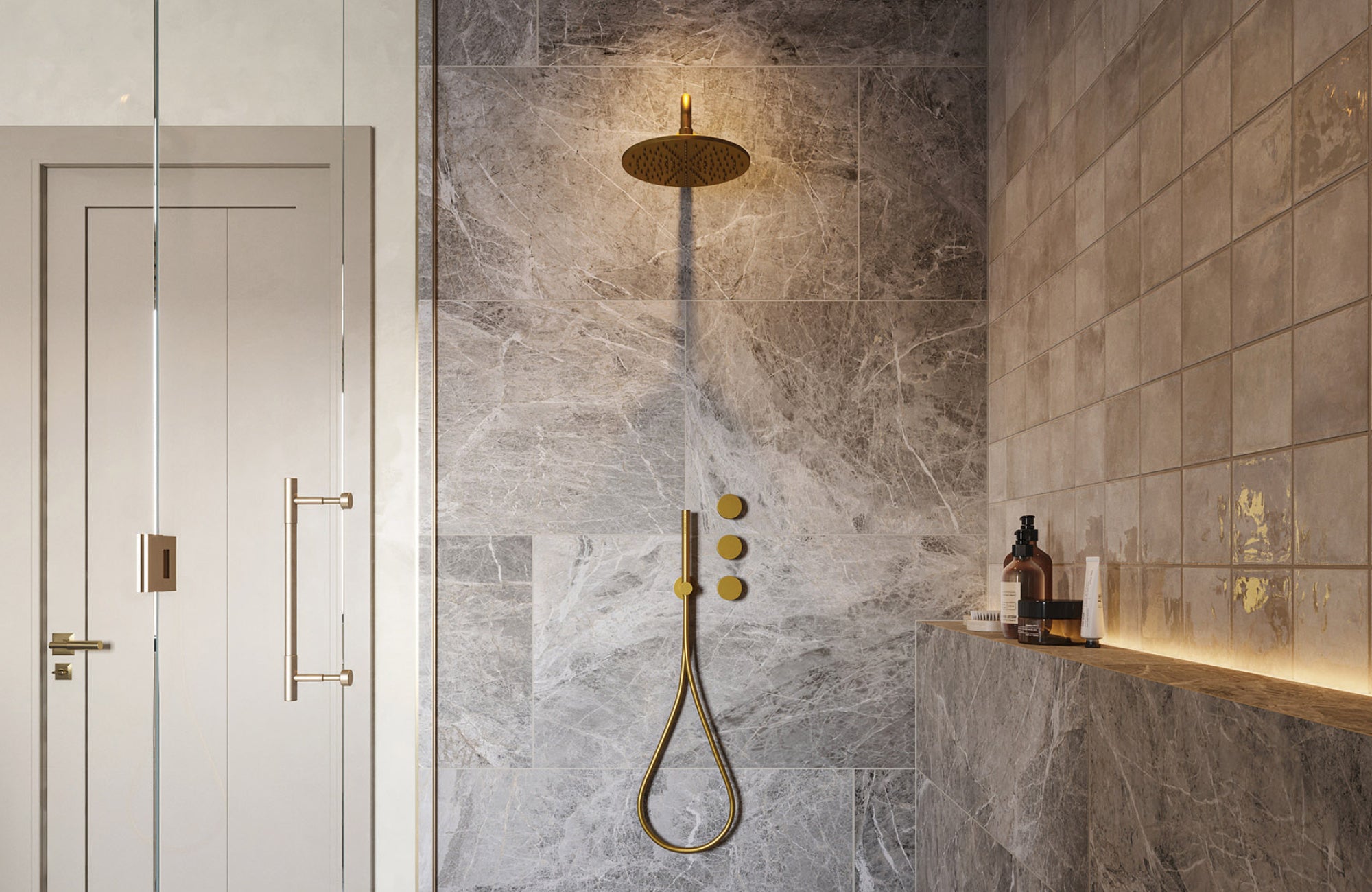Gray stone-look shower walls paired with gold fixtures and integrated shelving for a sleek, sophisticated atmosphere.